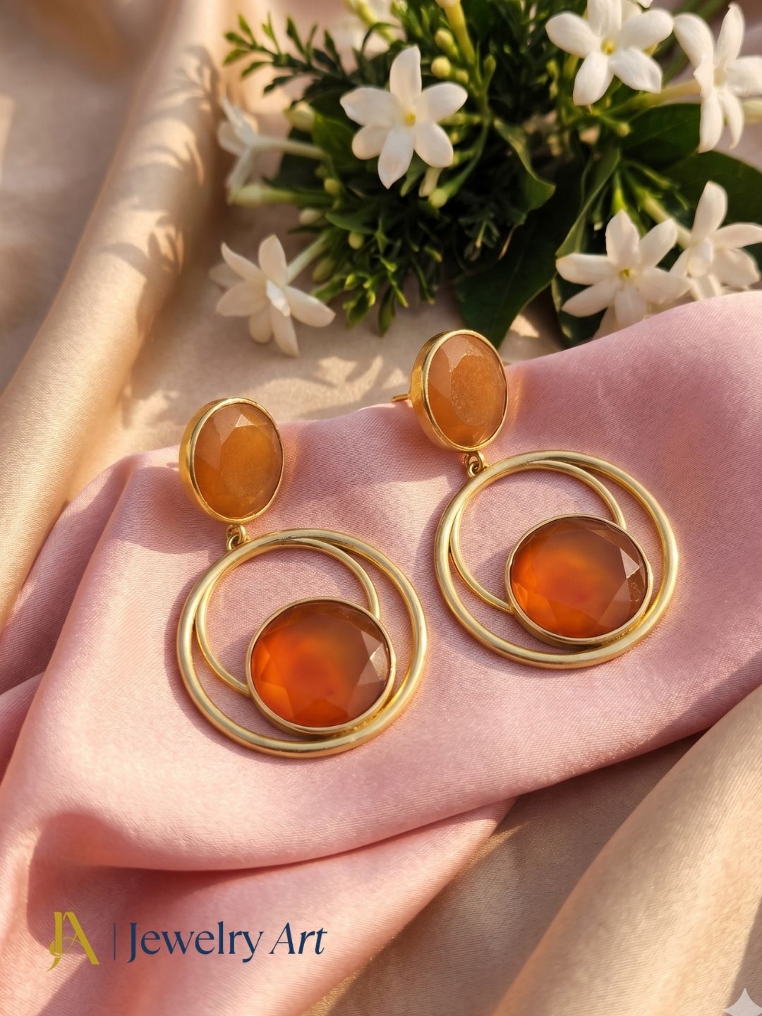 Creative arrangement of handcrafted Carnelian dangle earrings
