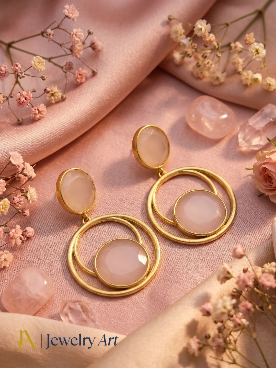 Gold plated Rose Quartz semi-precious gemstone dangle earrings showcased in luxury decorative jewelry styling.
