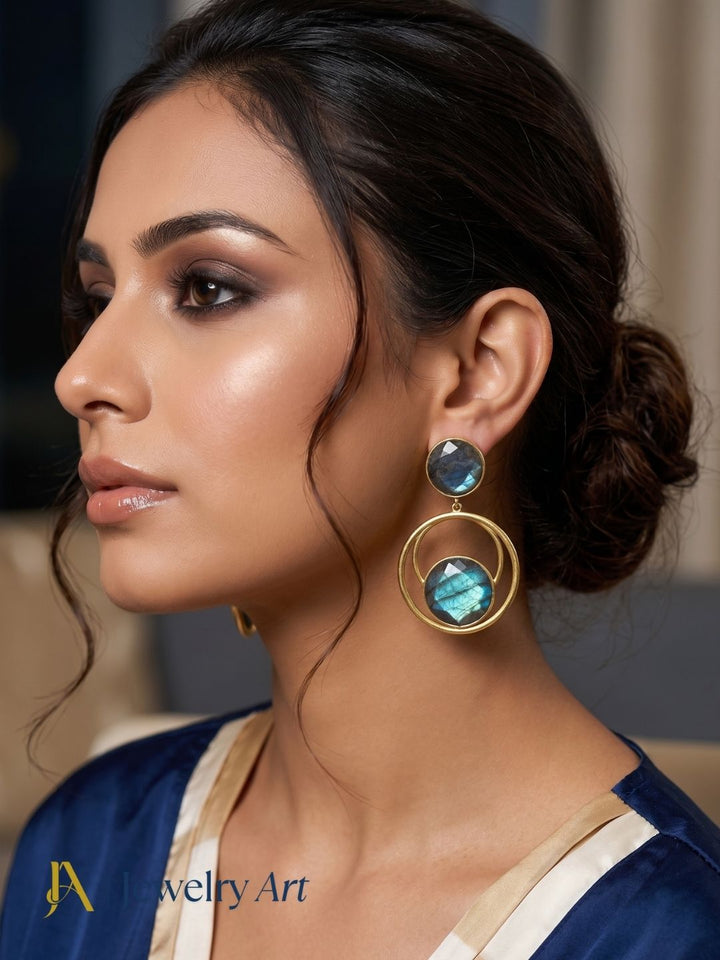 Model wearing contemporary gold plated Labradorite statement earrings

