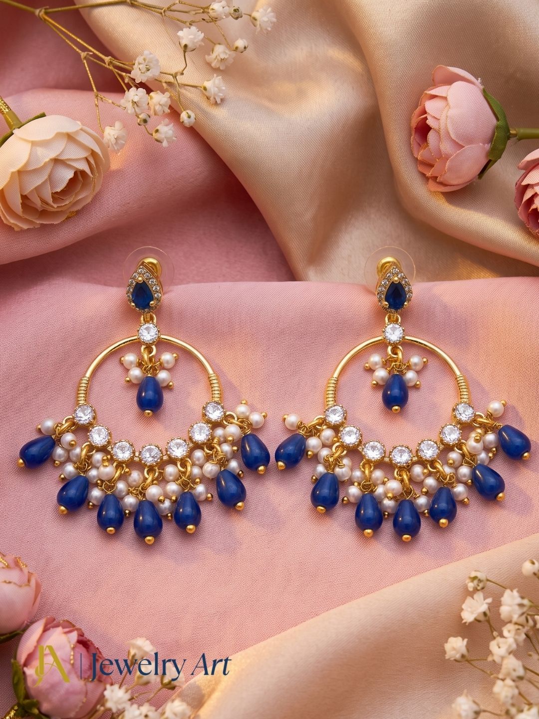 Decorative setup highlighting antique gold Moissanite statement earrings
