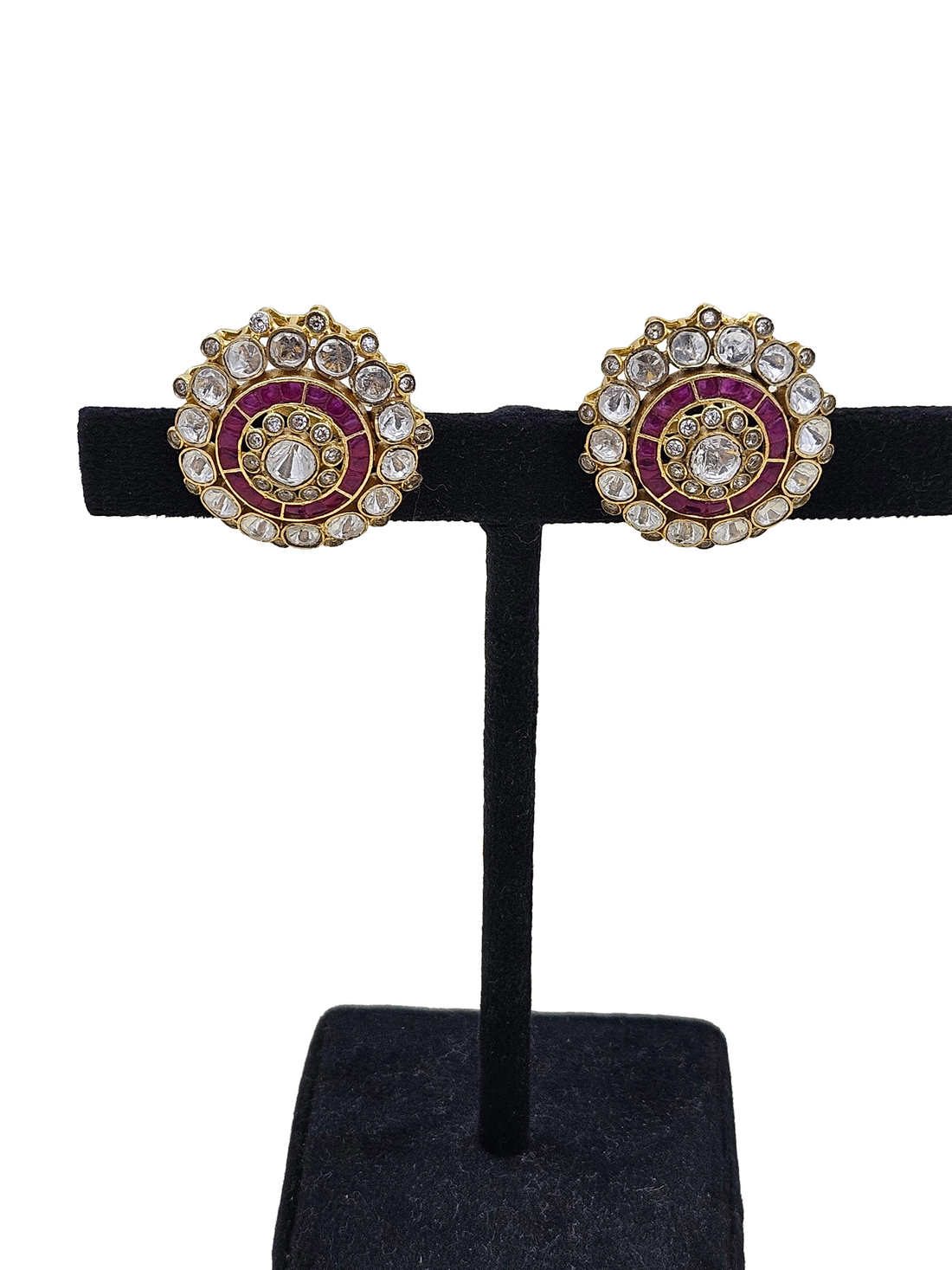 Handcrafted AD polki red stone studs displayed on earring mannequin stand – everyday women’s jewellery
