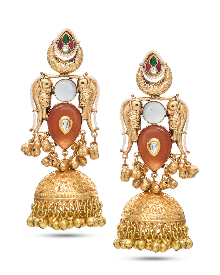 Antique gold motif jhumka earrings with multi‑color stones and drop dangle design
