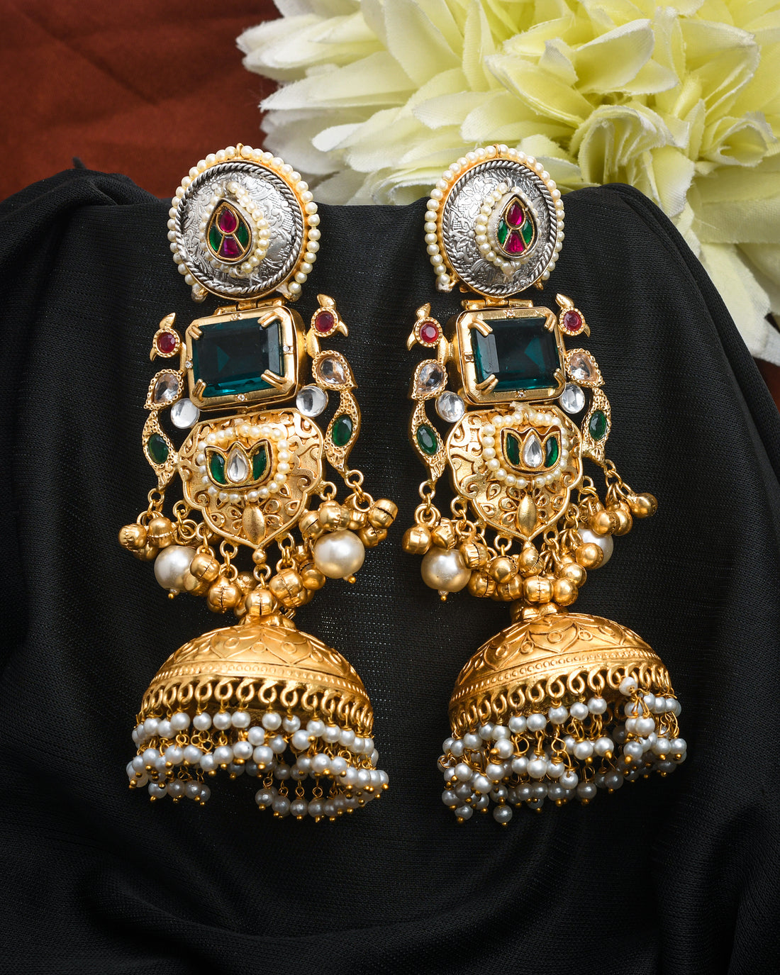 Multi-color motif jhumka earrings with antique gold finish in a classic dangle drop design
