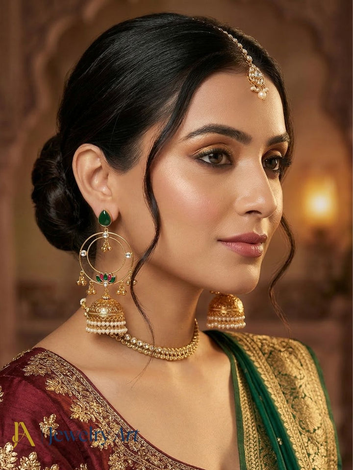 Traditional antique gold jhumka earrings with synthetic polky, green stone and pearl detailing
