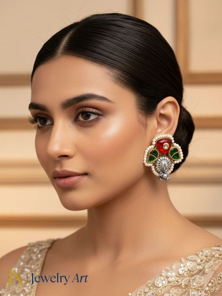 Beautiful ethnic stud earrings with oxidized metal, glass stone and pearl accents

