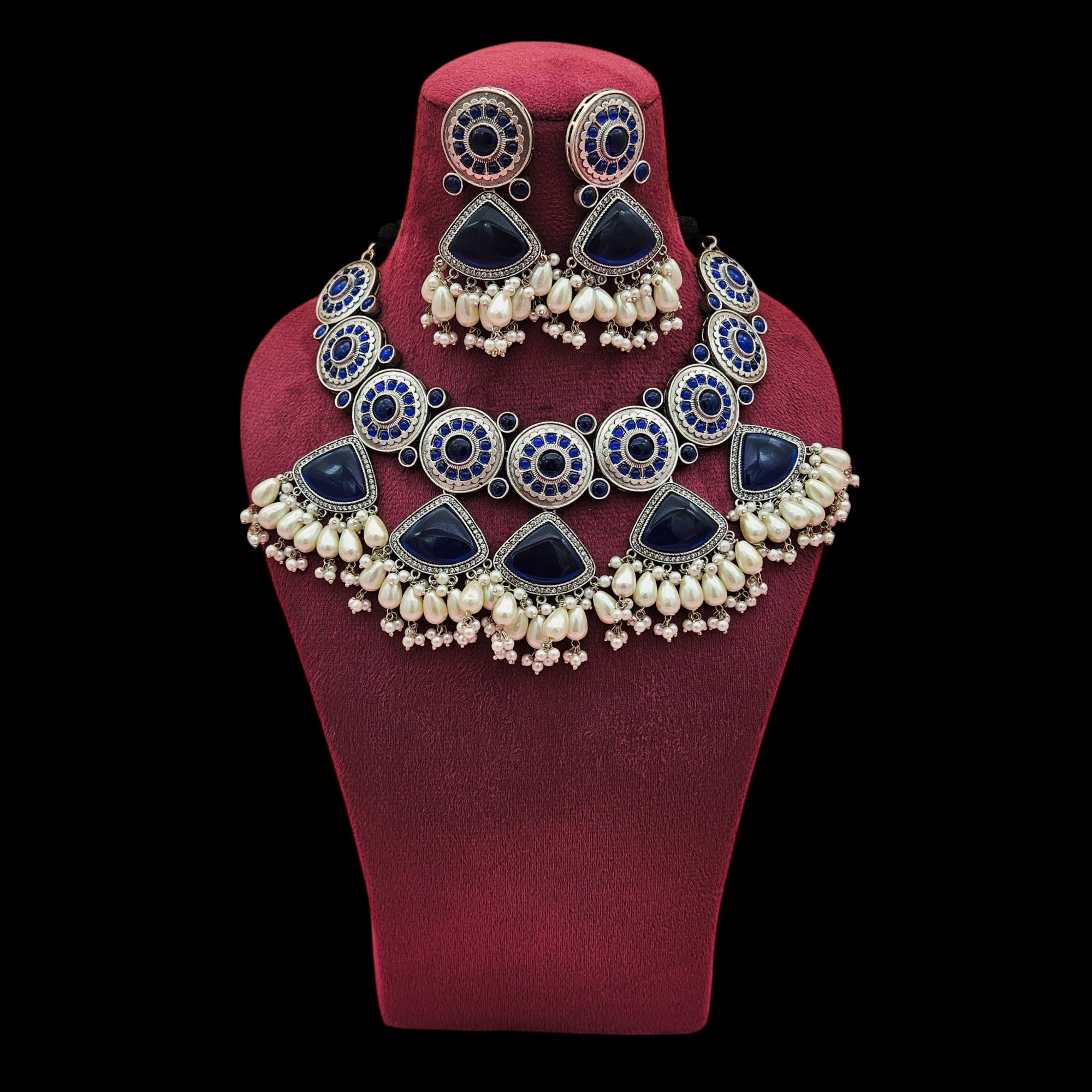 Women’s oxidized choker and earrings set with blue Monalisa stones, pearls, and AD embellishments – boho ethnic design
