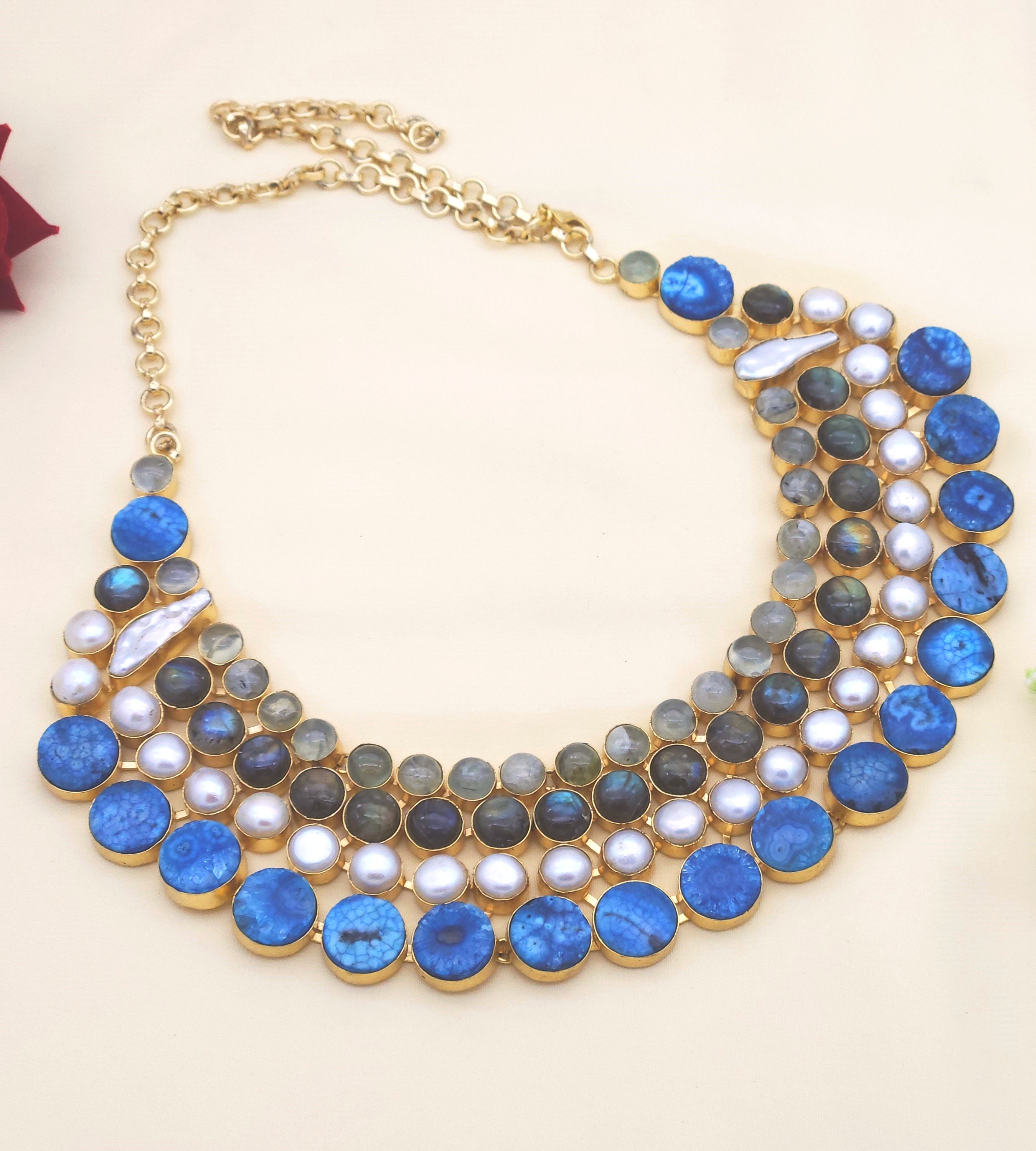 Handcrafted broad necklace with Prehnite, Labradorite, solar quartz and pearls in antique gold plated finish
