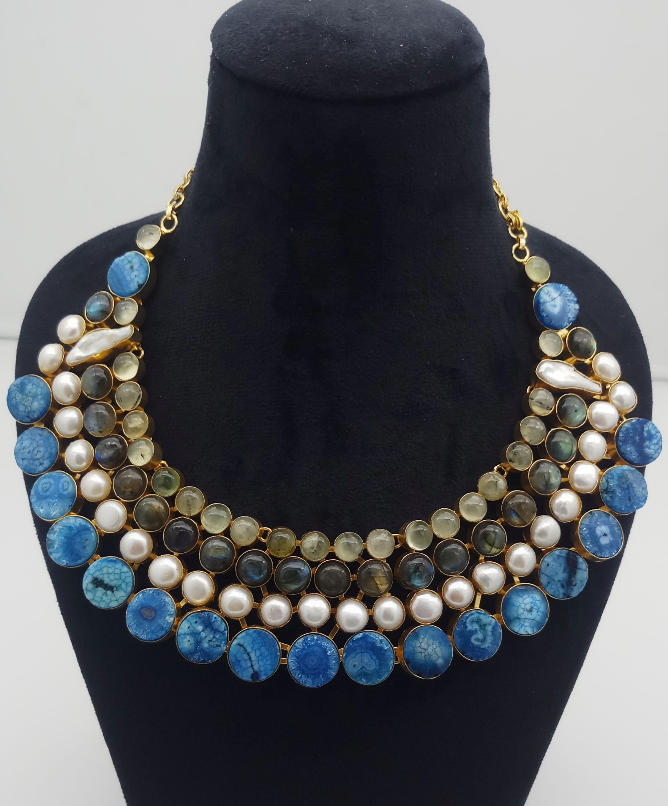 Designer necklace with mixed gemstones and antique gold plating styled on neck – includes Prehnite, Labradorite, Solar Quartz, and pearls
