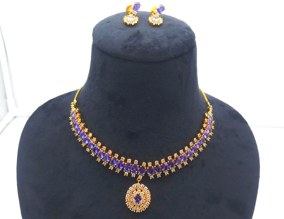 Designer necklace and earrings set in antique gold plating with amethyst hydro quartz and cubic zirconia for festive wear
