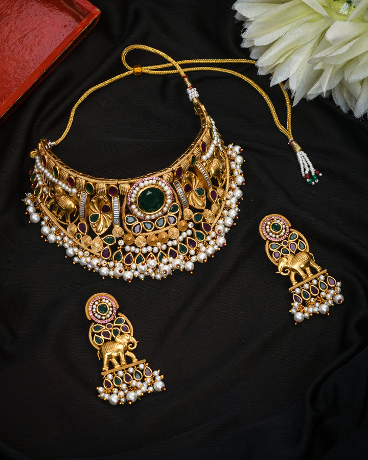 Elegant antique gold choker and earrings set with colorful Kundan Polky stonework – ethnic jewelry"
