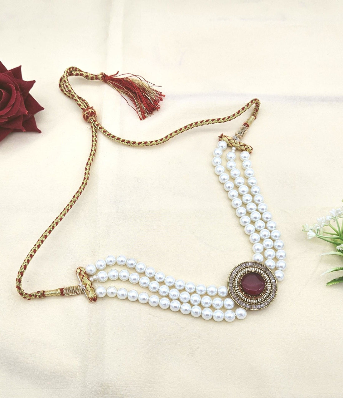 Designer antique choker necklace with AD shine, red synthetic stones, and soft pearl highlights
