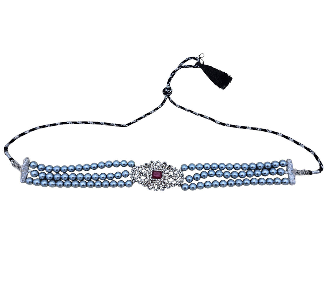 Ornate silver-tone choker necklace with American diamonds, red synthetic gems, and classic pearls – festive wear
