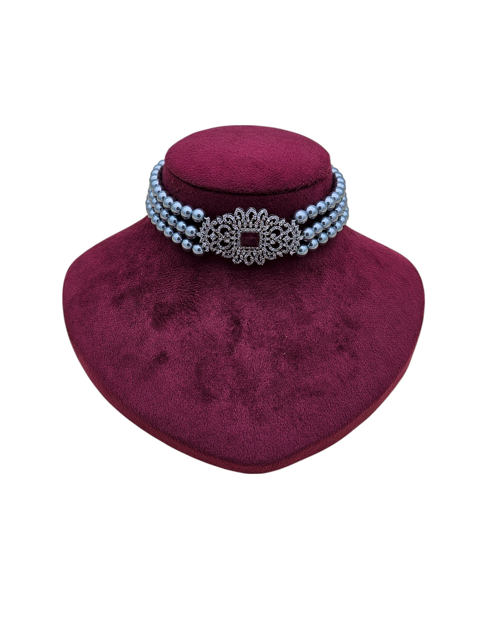 Antique-inspired silver choker with AD stones, deep red synthetic gems, and timeless pearl detailing
