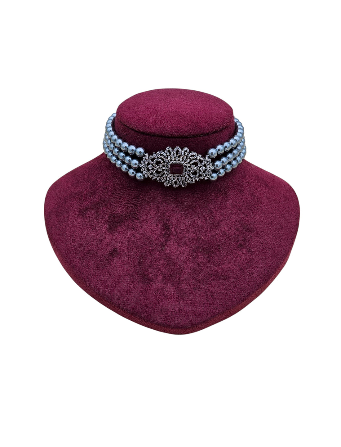 Antique-inspired silver choker with AD stones, deep red synthetic gems, and timeless pearl detailing
