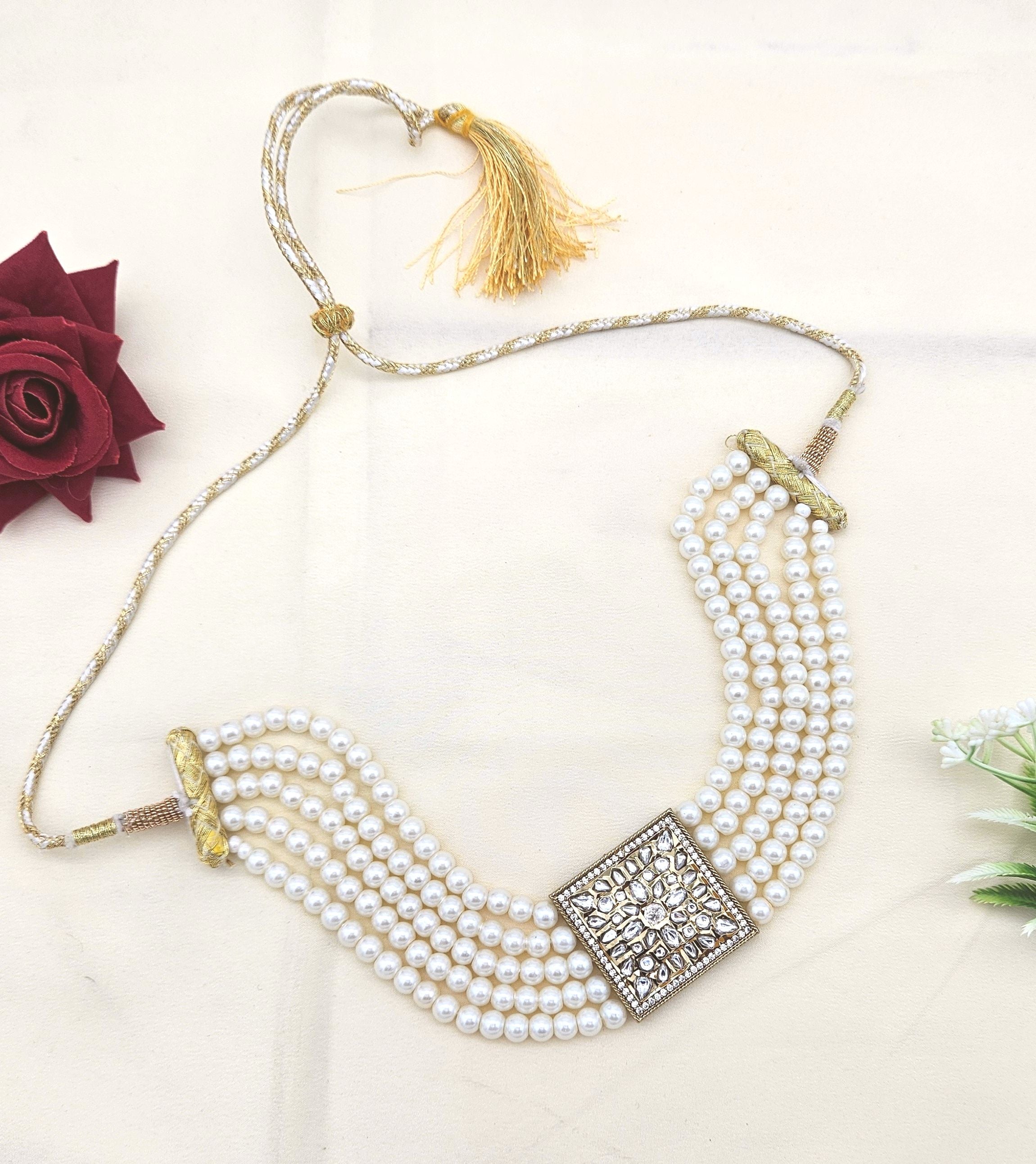 Antique gold choker necklace featuring synthetic Polky, American diamonds, and classic pearl accents
