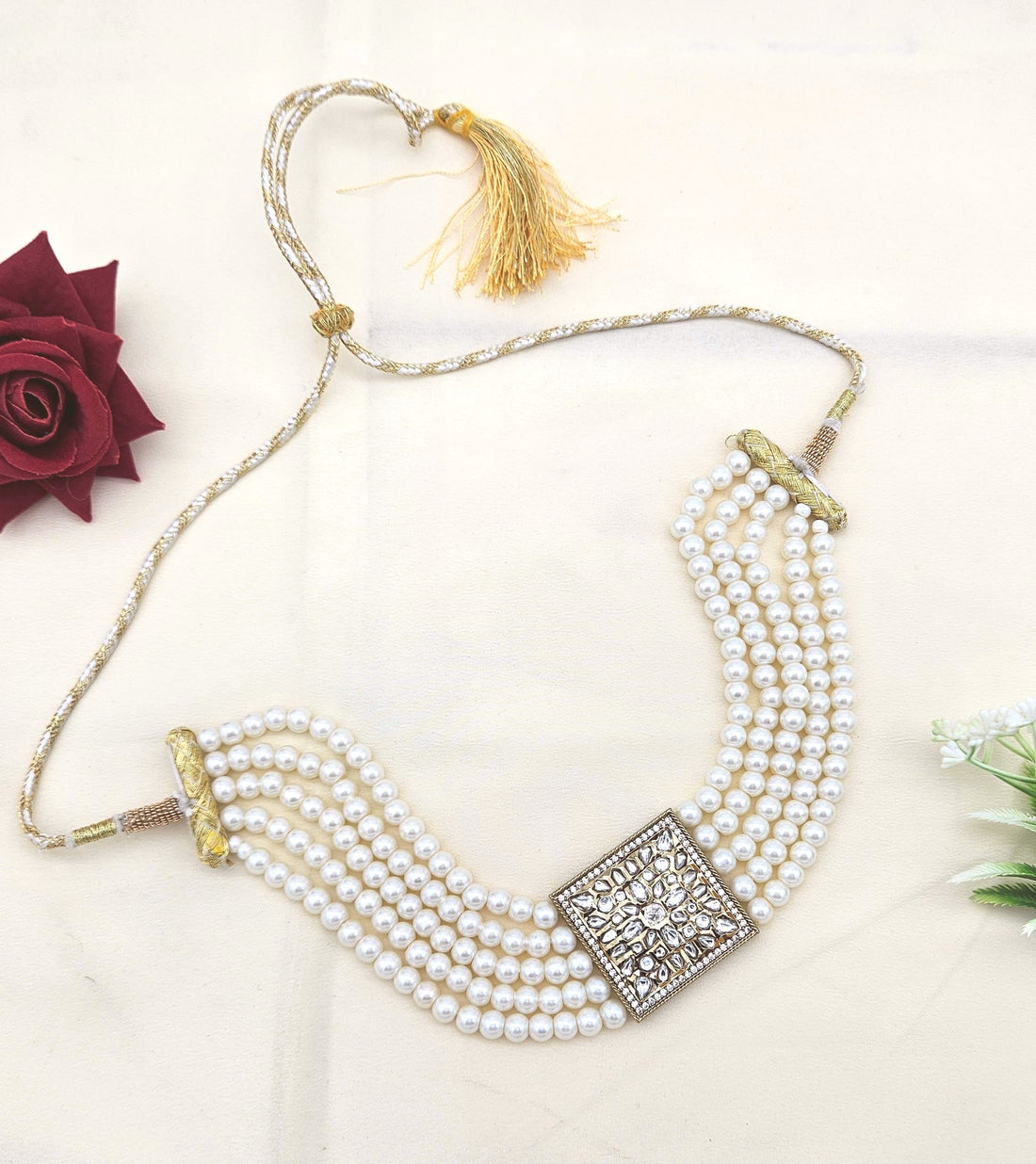 Antique gold choker necklace featuring synthetic Polky, American diamonds, and classic pearl accents
