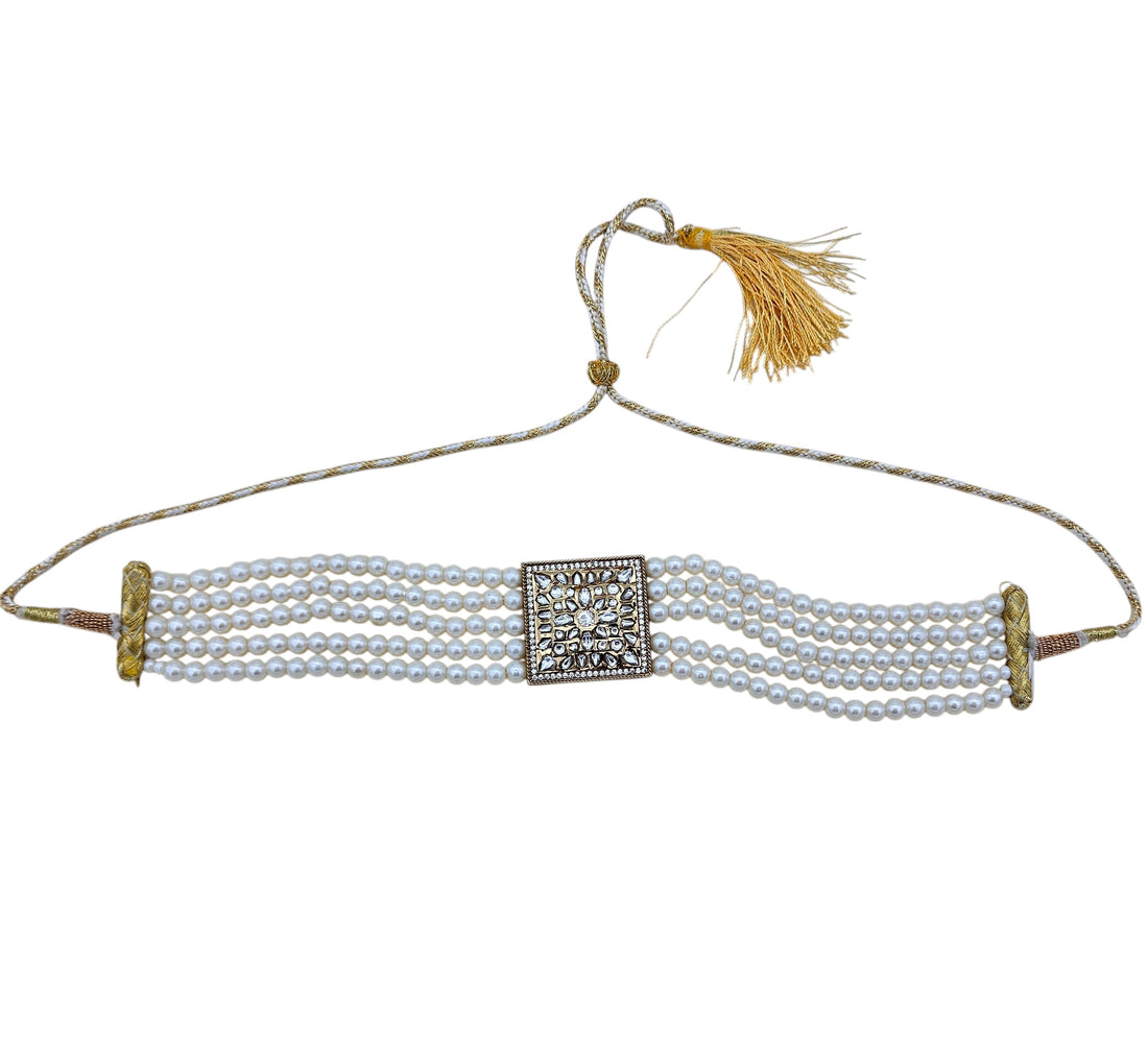 Festive antique gold choker necklace embellished with synthetic Polky, American diamonds and pearls
