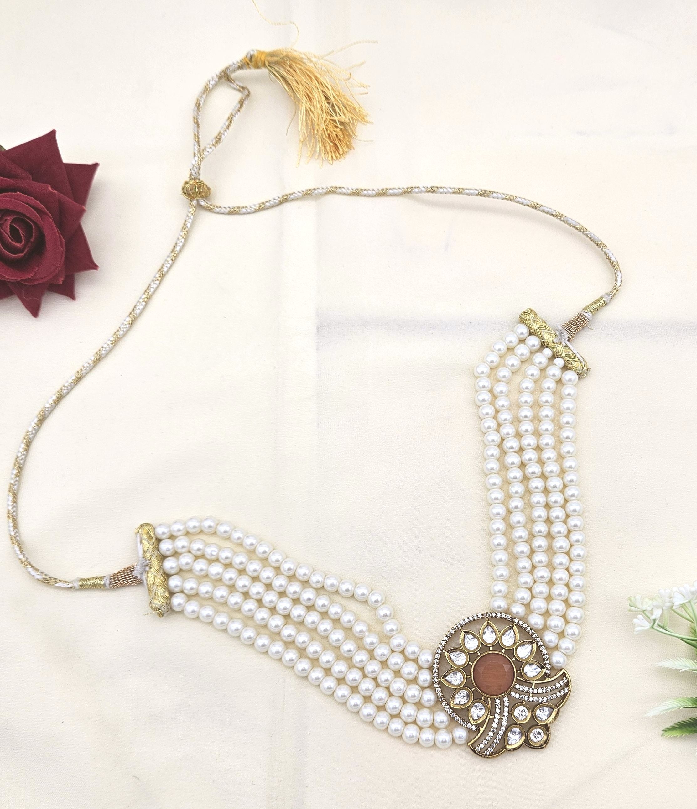 Gold finish choker necklace with synthetic Polky, yellow Monalisa stones, AD embellishments, and pearl details
