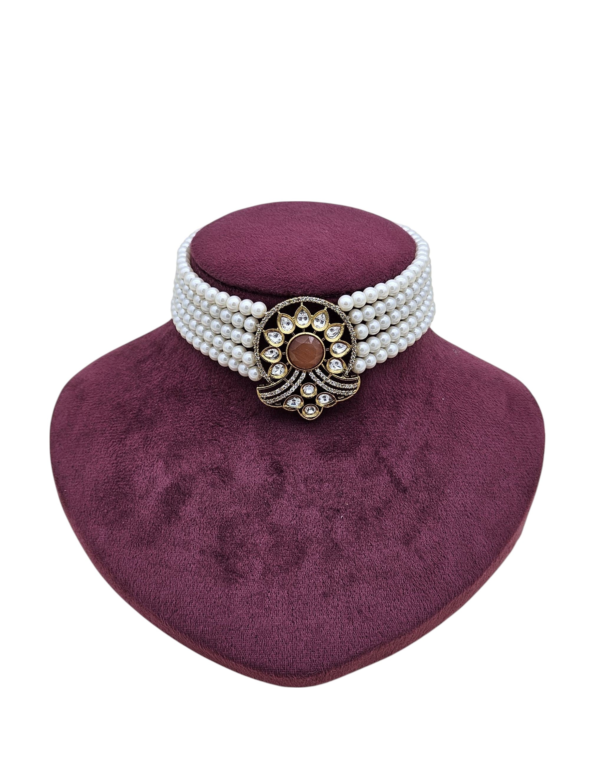 Designer choker in gold tone with synthetic Polky, American diamonds, yellow Monalisa gems and pearl decorations
