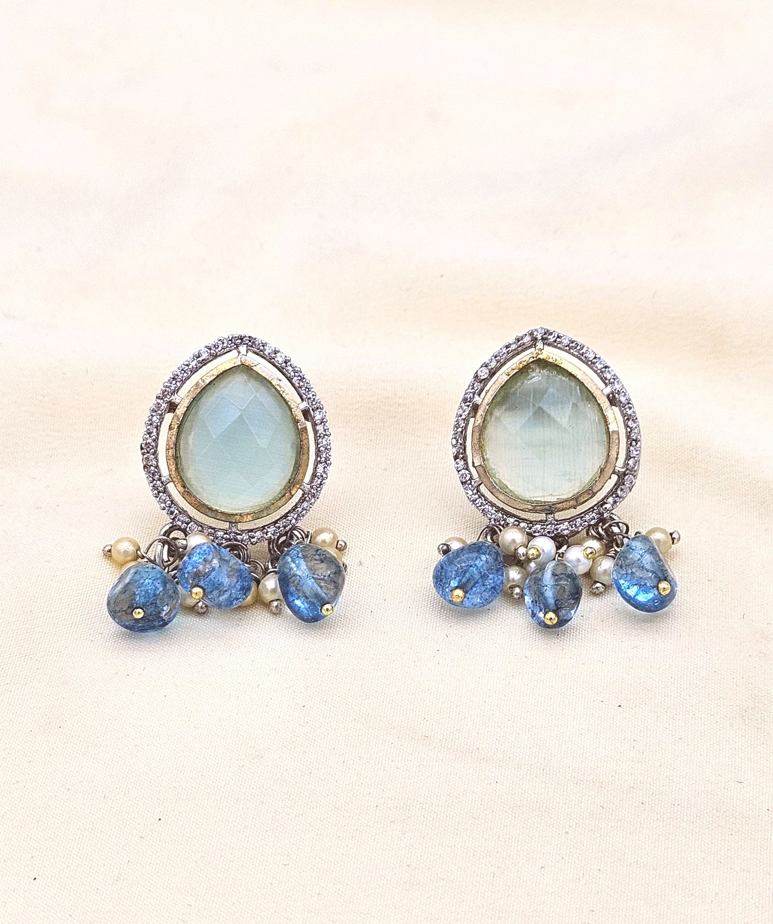 Designer antique gold earrings with Monalisa stone, AD Polky work, and a pearl drop
