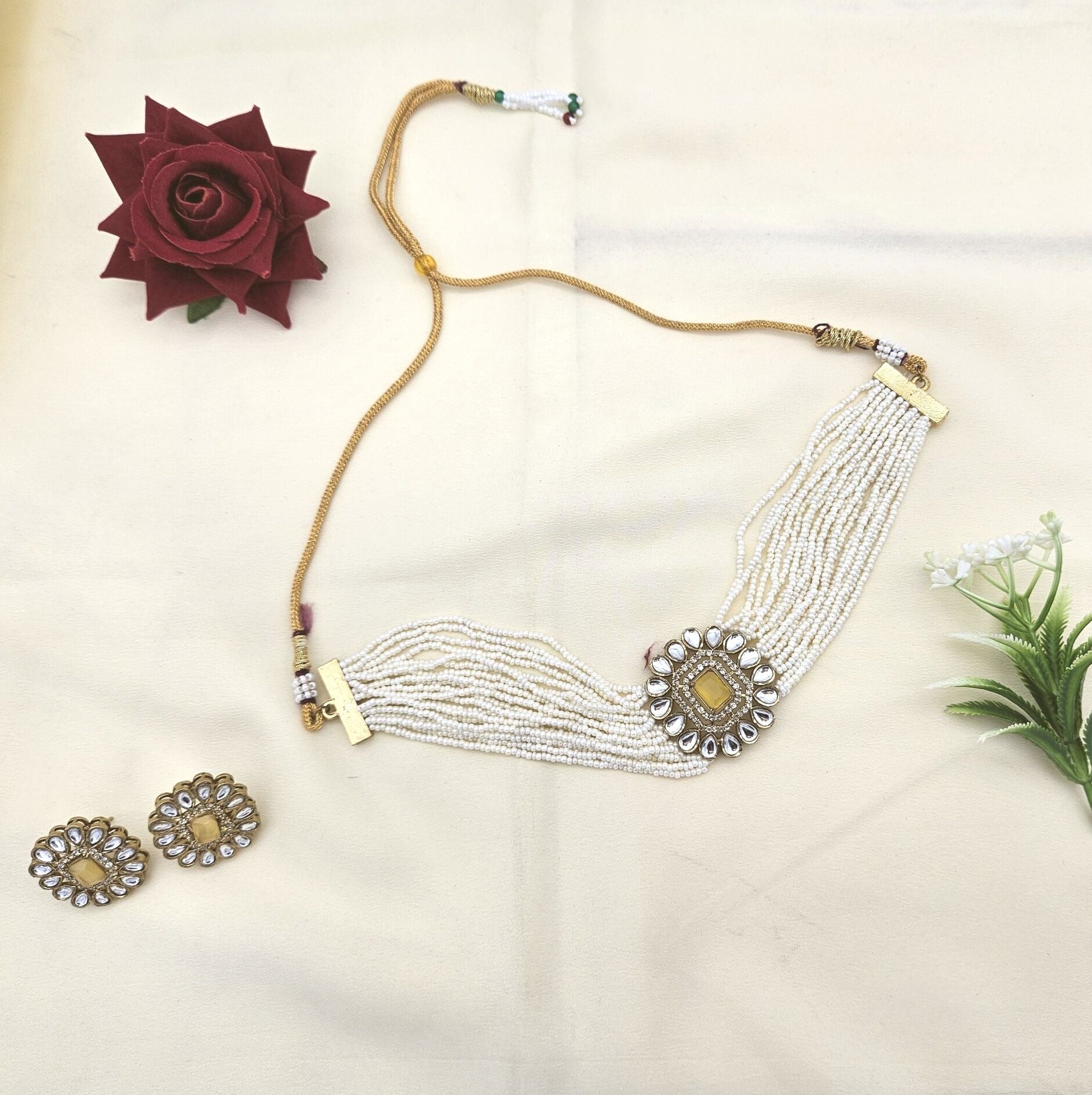 Handcrafted antique gold choker set with synthetic Polki, American diamonds, Monalisa stones, and delicate pearls
