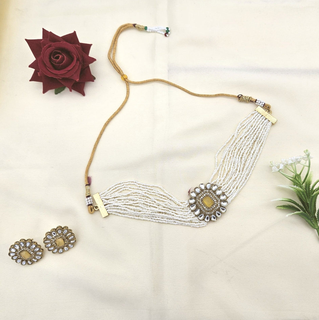Handcrafted antique gold choker set with synthetic Polki, American diamonds, Monalisa stones, and delicate pearls
