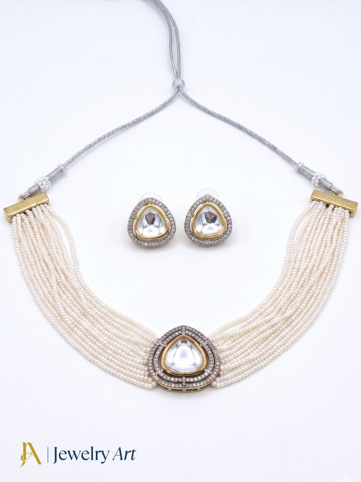 Statement antique gold choker set with pearl accents and elegant earrings
