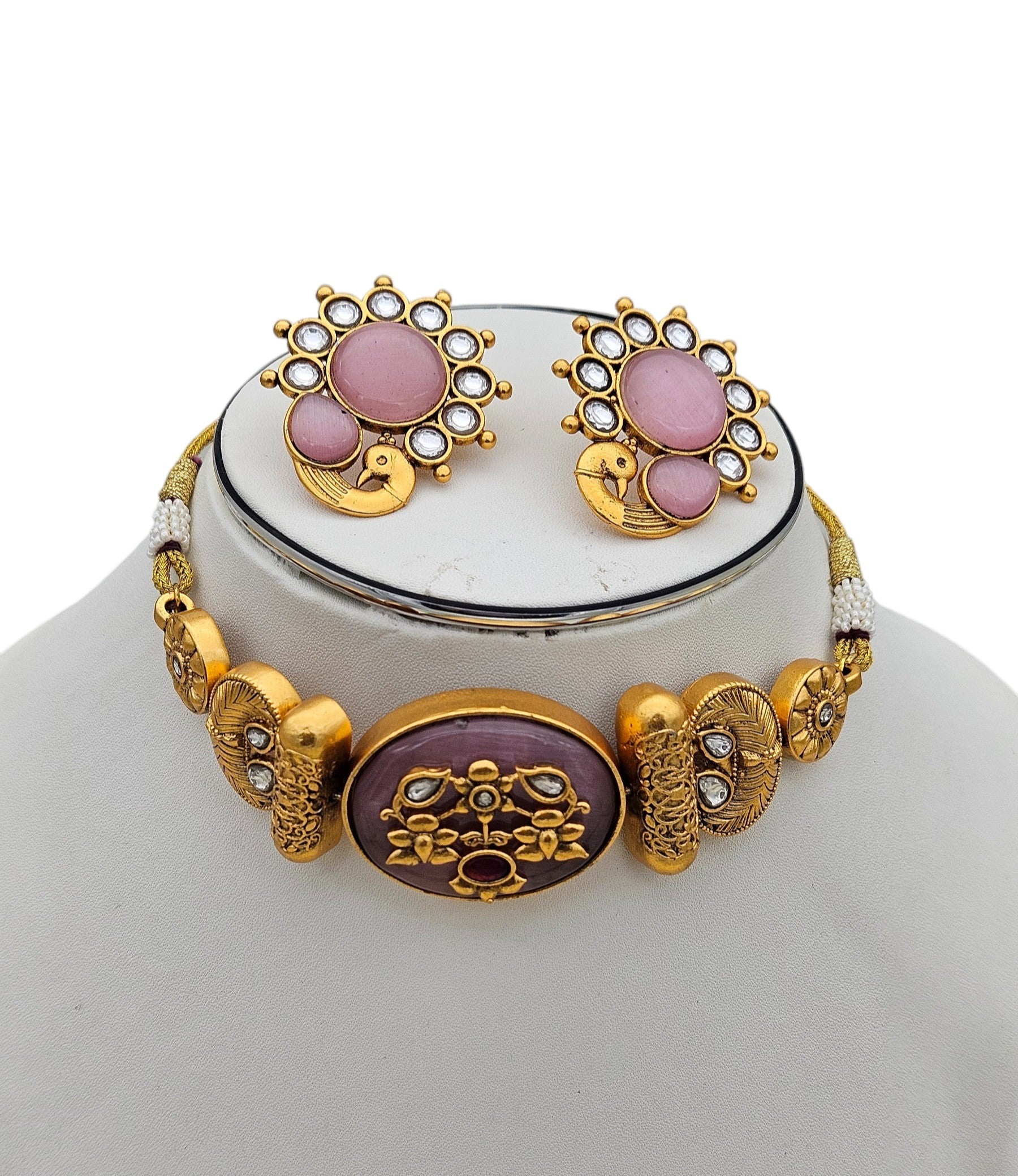 Close‑up of synthetic Polki and pink Monalisa glass stones set in antique gold‑plated choker
