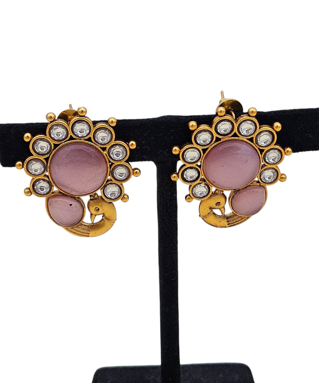 Close‑up of matching earrings with pink Monalisa glass stones and synthetic Polki teardrops
