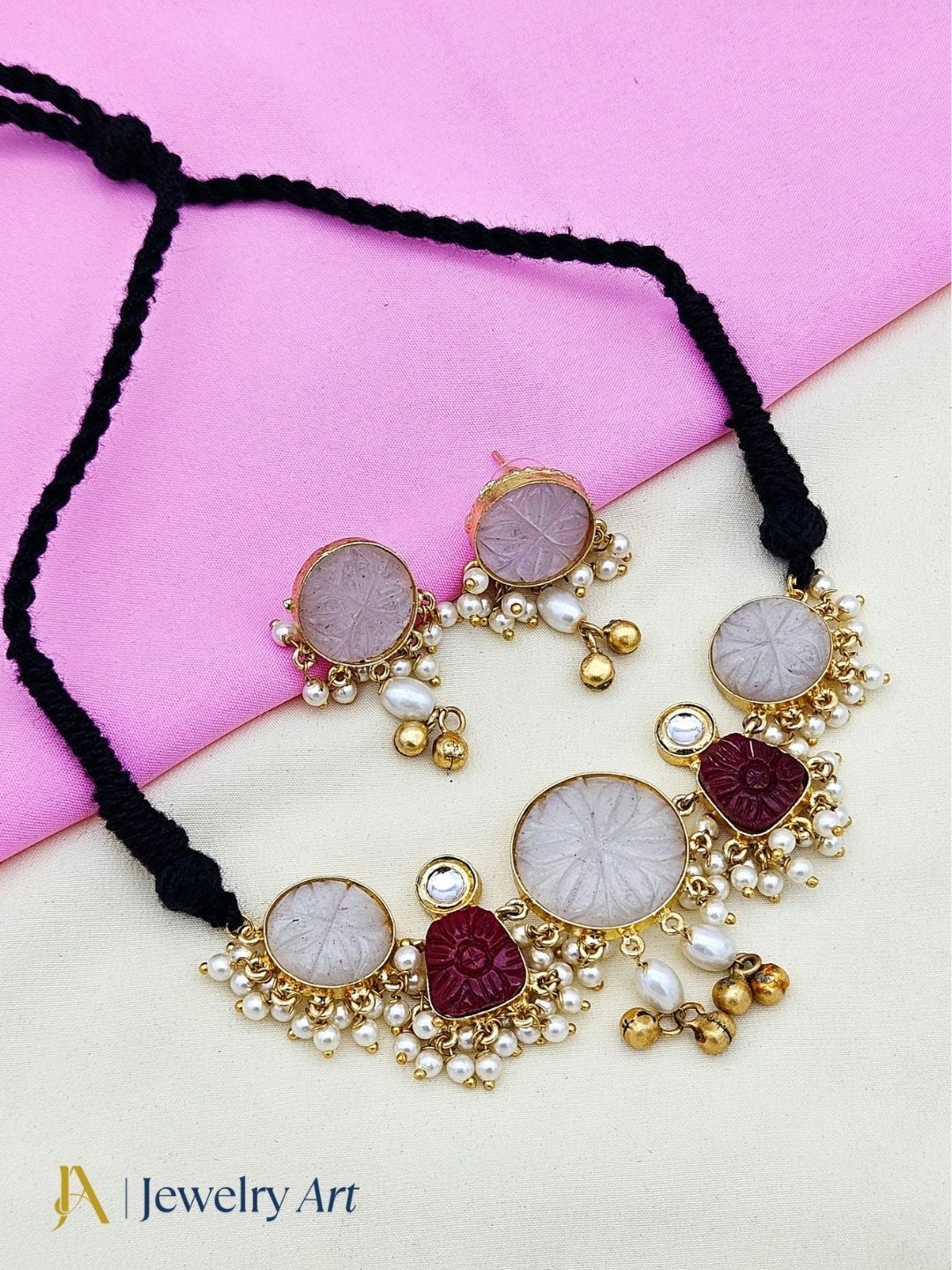 Antique gold plated necklace set with synthetic pearls red glass stones and polky work
