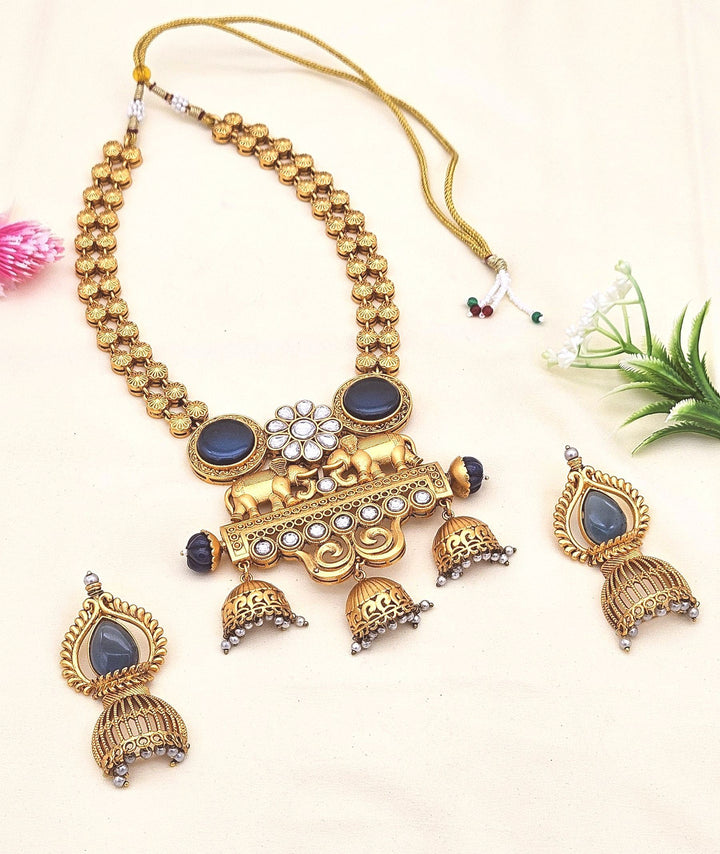 Antique gold plated Polki necklace set with blue Monalisa stones, glass pearls, and matching earrings
