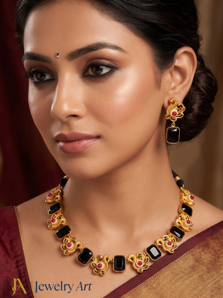Beautiful handcrafted necklace earrings set with pearl detailing and antique gold finish
