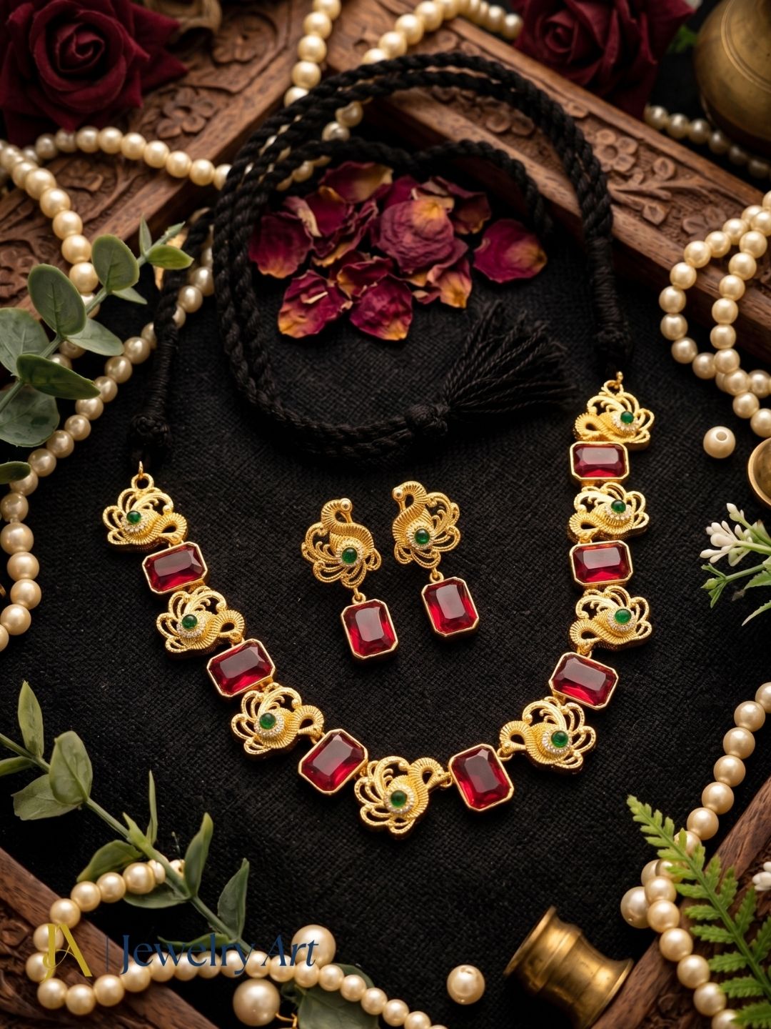 Elegant black cotton thread necklace set with red glass stones and matching earrings
