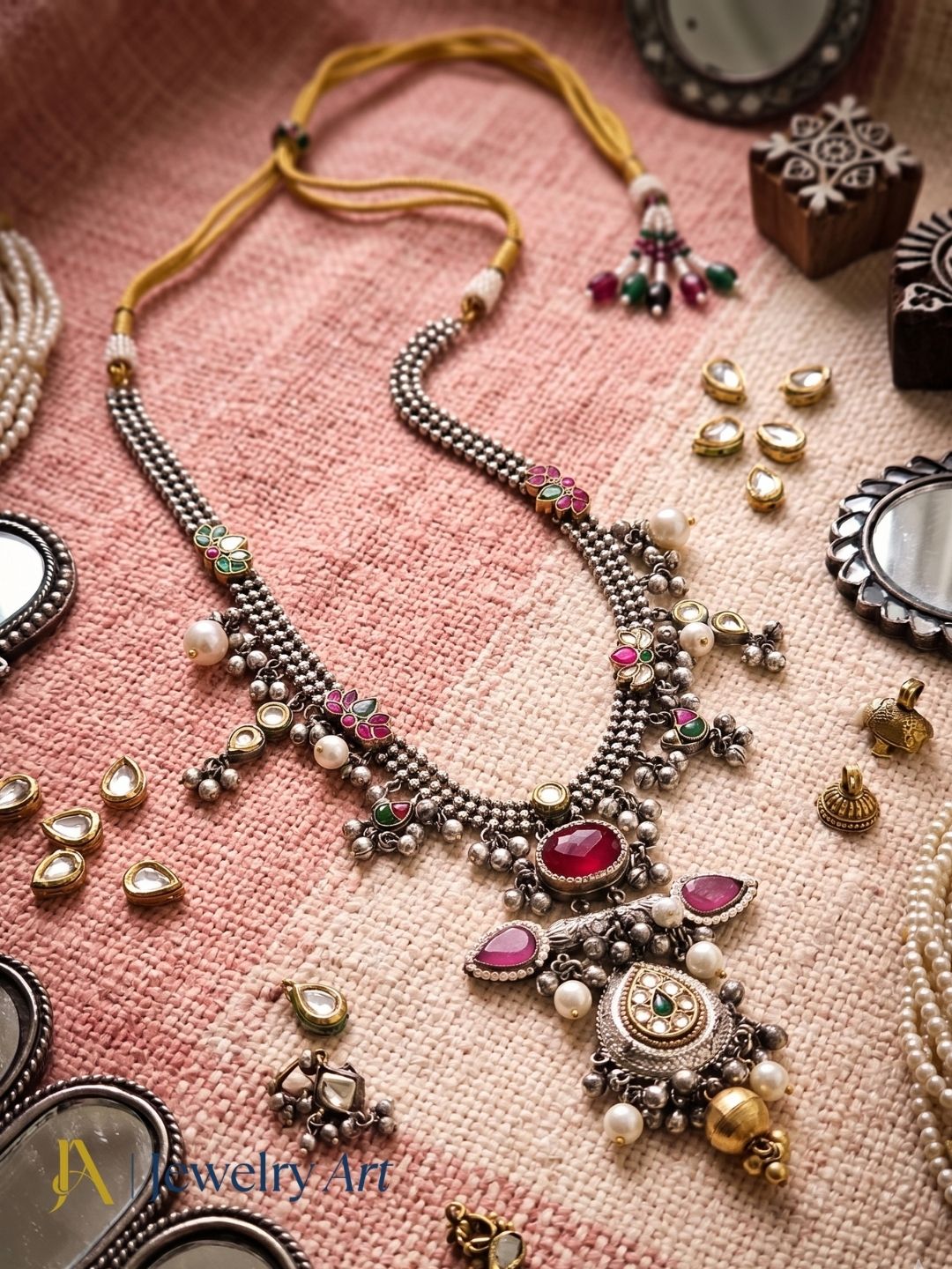Luxury silver oxidized long necklace with faux kundan polky, red glass stones, pink Monalisa stones, and pearl detailing
