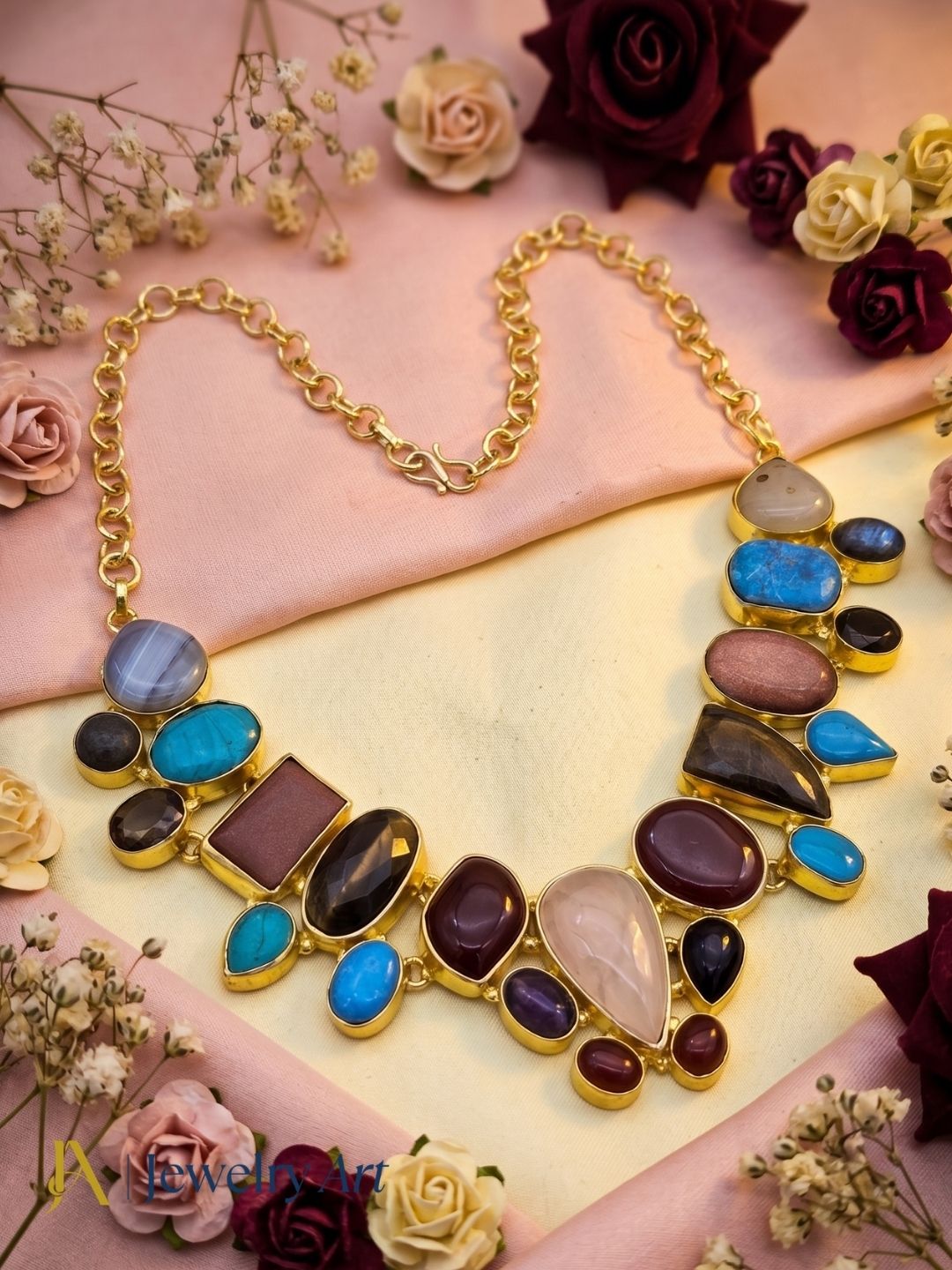 Premium gold plated ethnic statement necklace with vibrant semi precious stone accents
