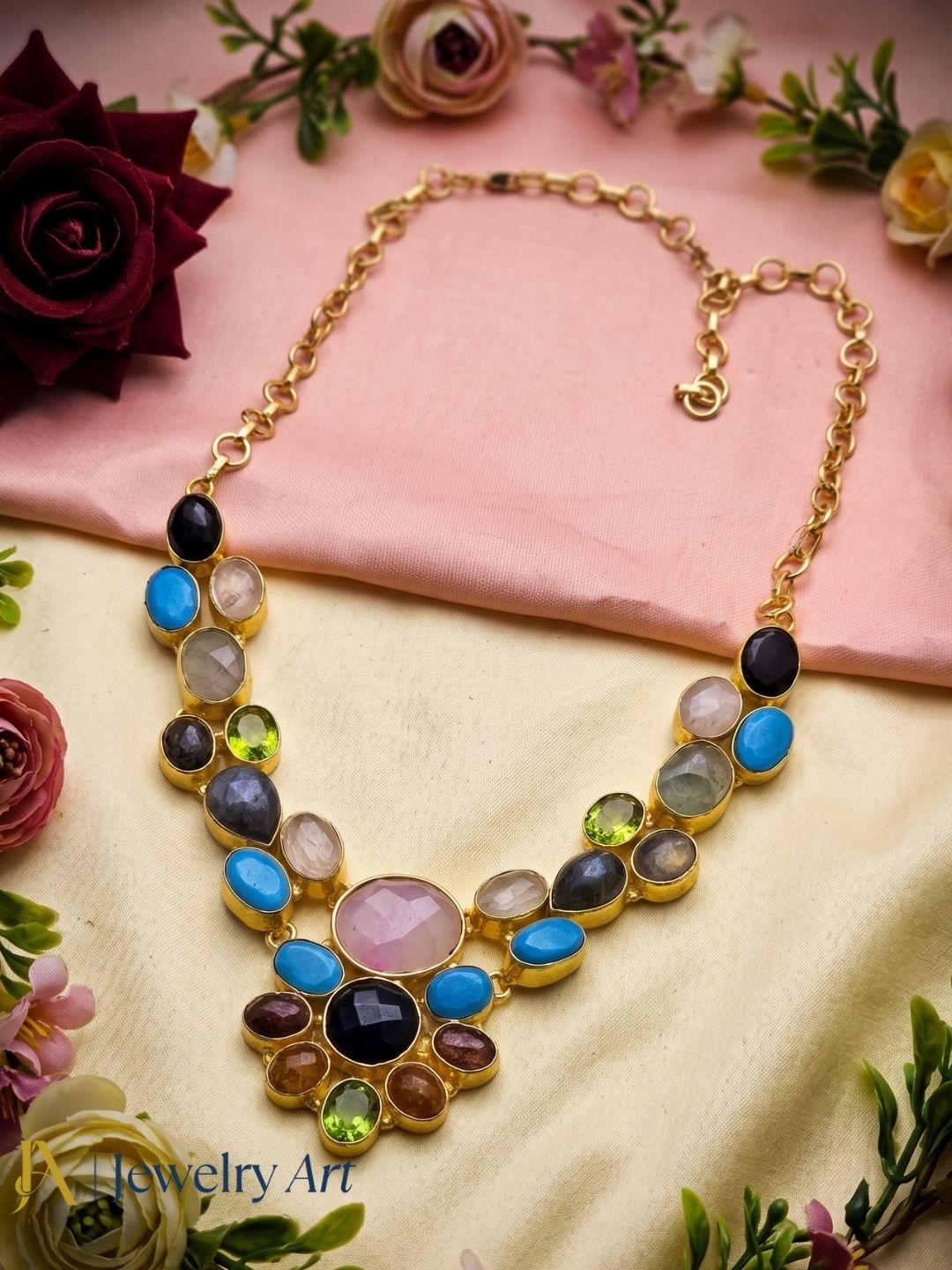 Artistic gold plated statement necklace with vibrant semi precious stones
