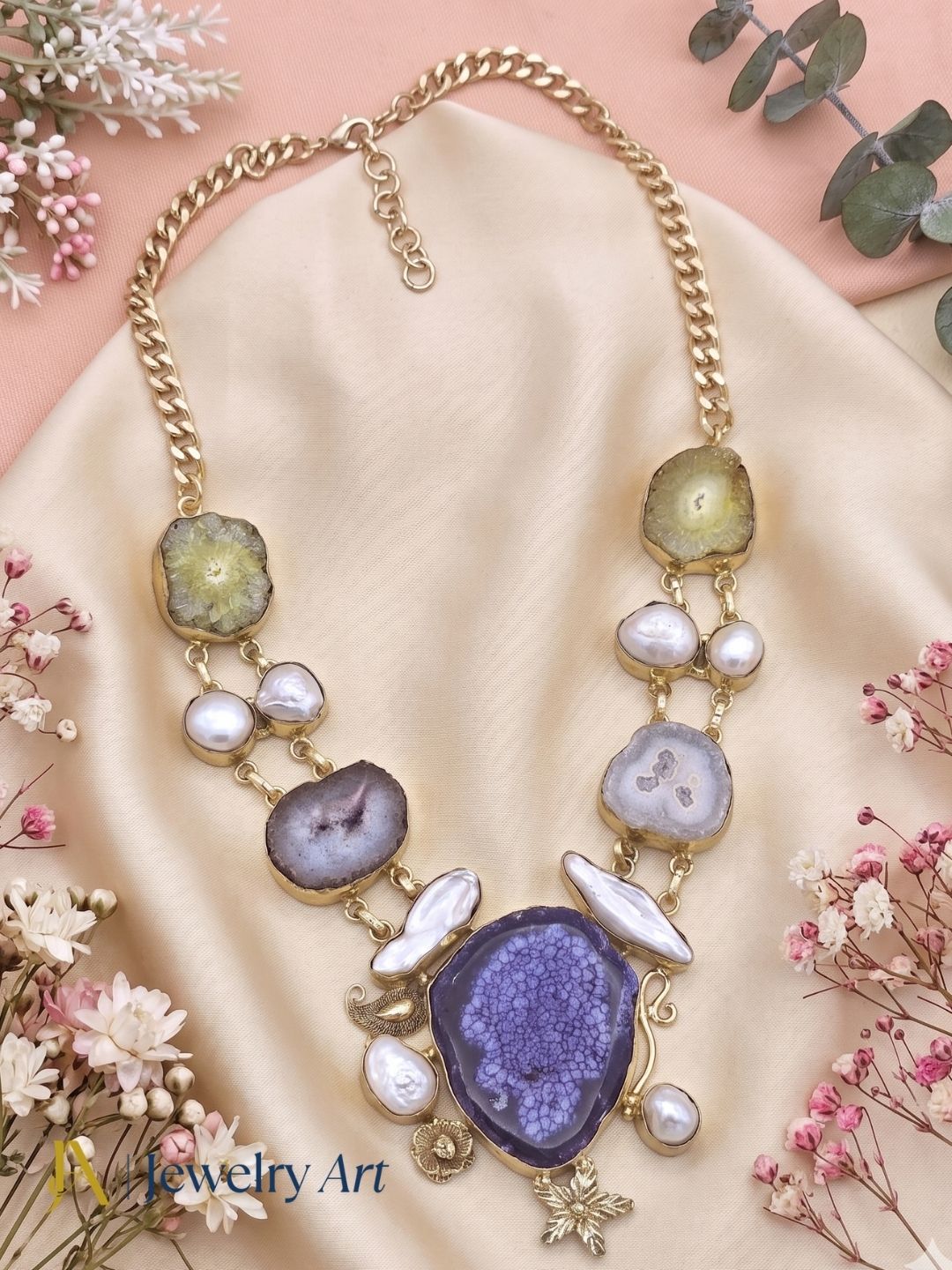 Fashion statement necklace with multicolor stones and elegant pearl detailing
