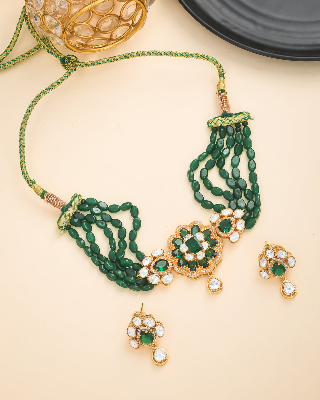 Designer broad choker necklace and earrings in antique gold with green jade and Kundan Polky stones
