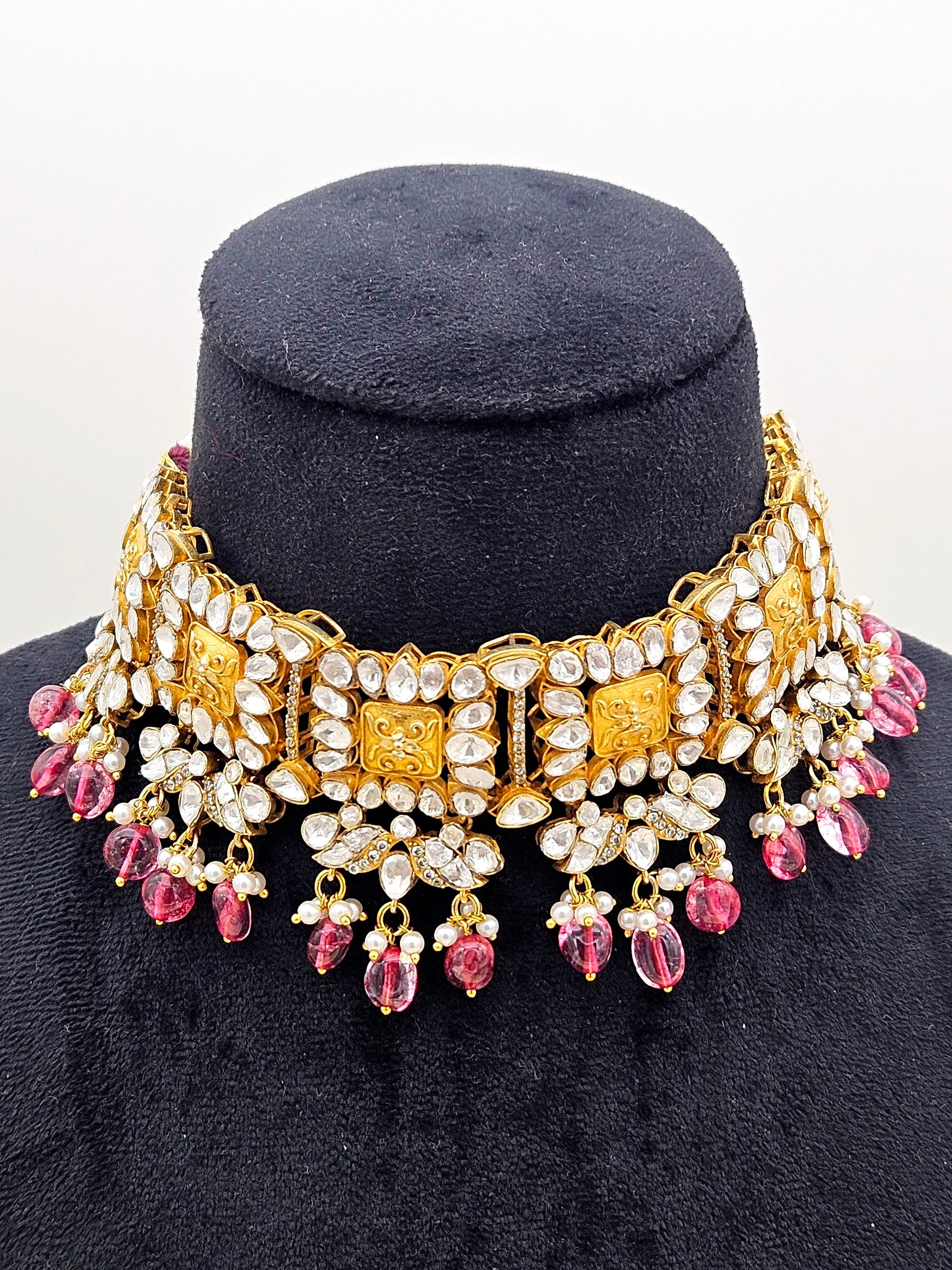 Red hydro quartz polki choker necklace in gold plating displayed on a neck stand – elegant ethnic jewellery
