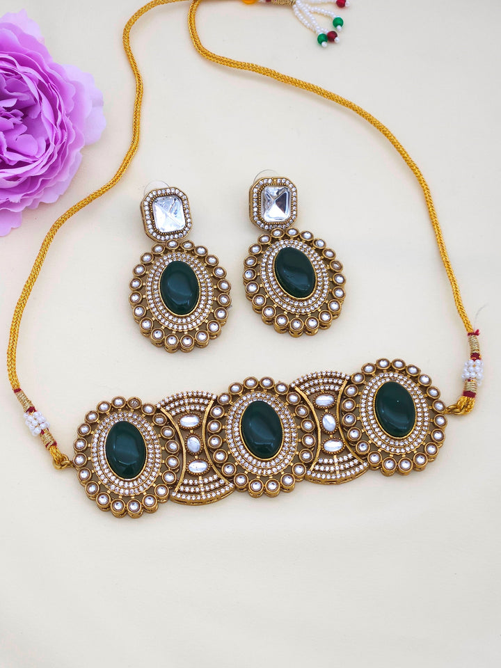 Women’s party wear choker set in antique gold – artistic designer necklace and earrings for festive looks
