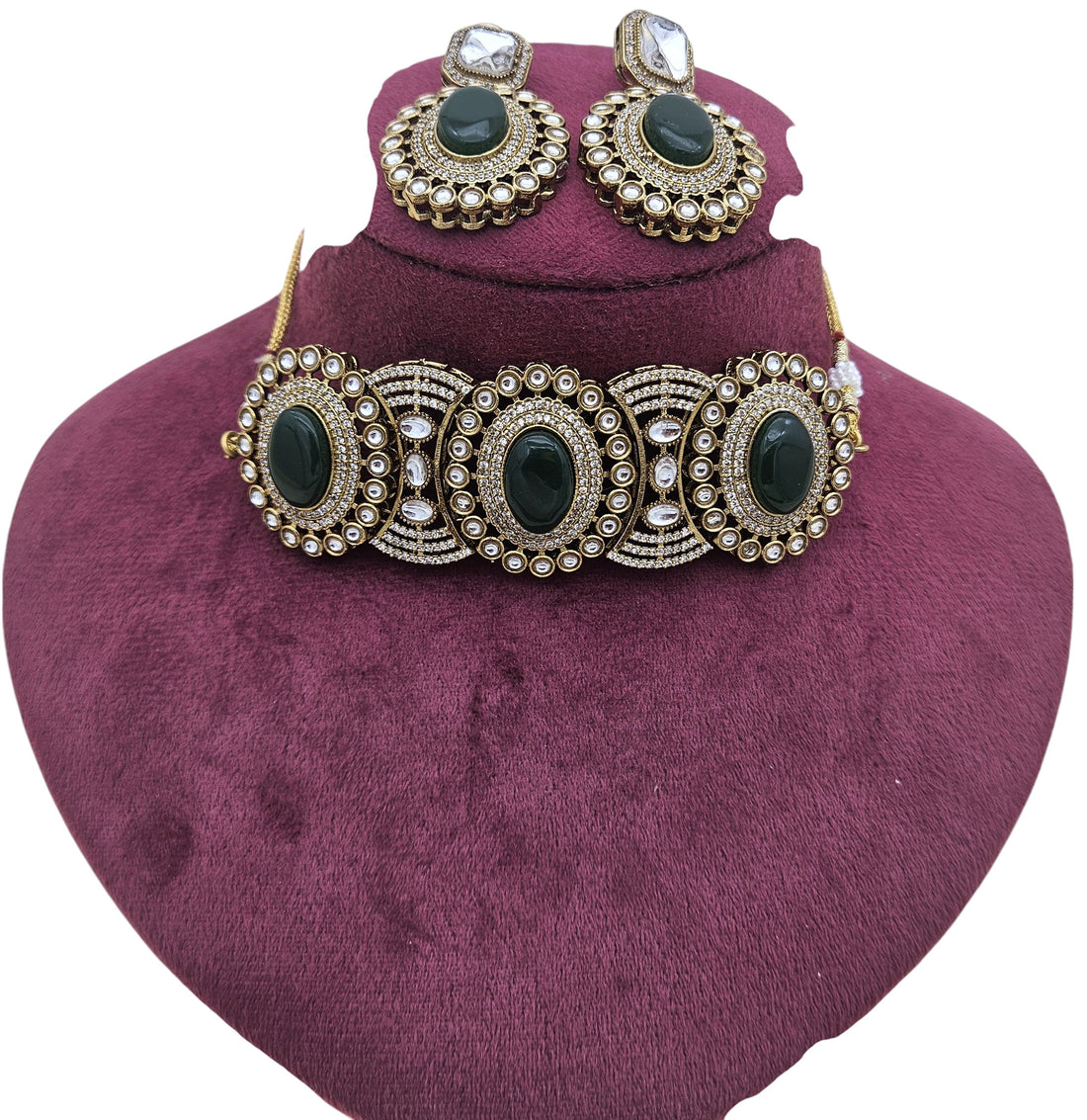 Detailed view of women’s antique gold choker necklace with matching earrings – traditional designer jewelry
