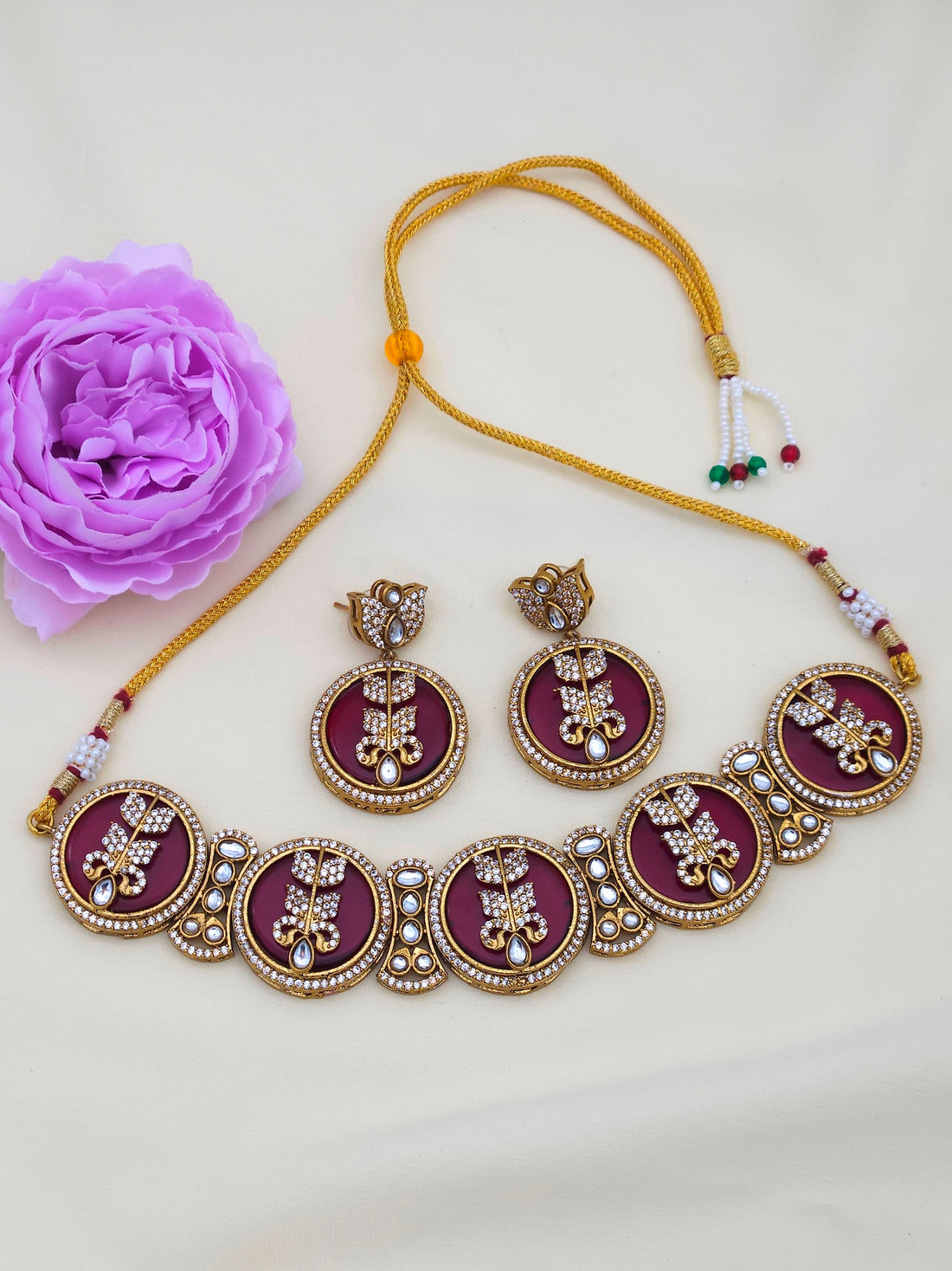 Designer party wear choker necklace and earring set in antique gold plating for women’s festive fashion
