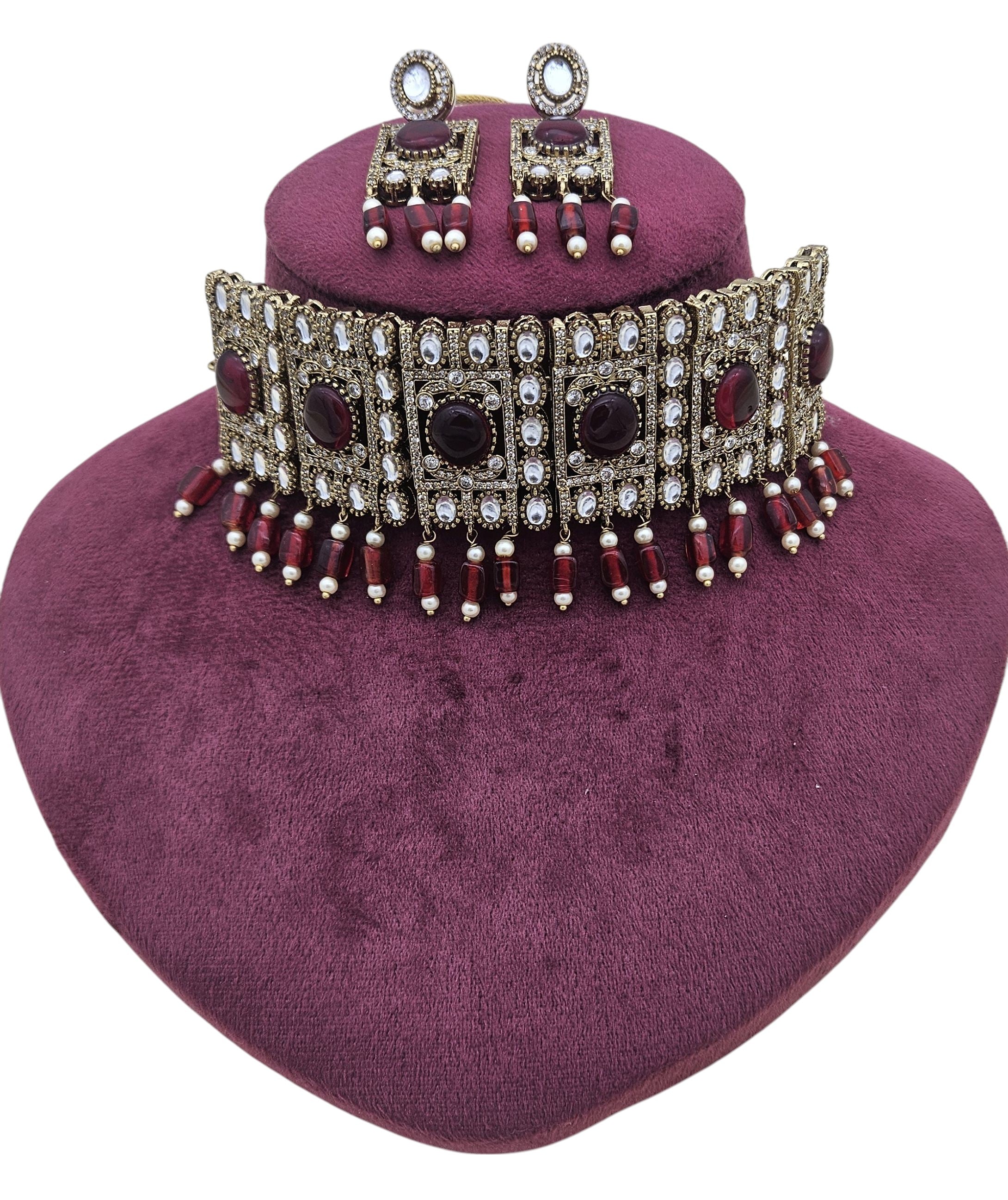 Detailed close-up of antique finish gold choker set showcasing ornate patterns and fine craftsmanship – perfect for party wear
