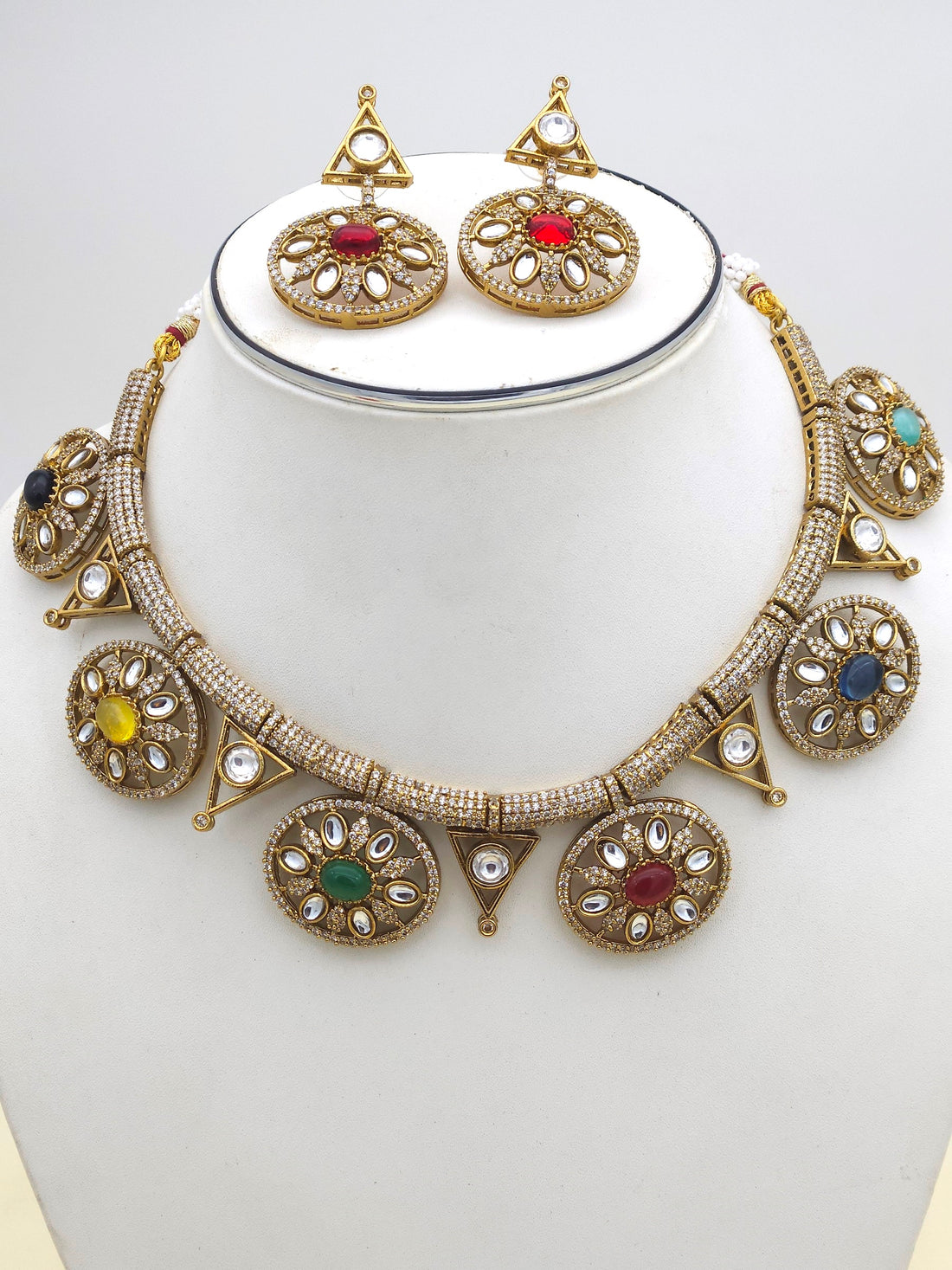Detailed view of antique gold jewelry set showcasing intricate Polky and American diamond craftsmanship
