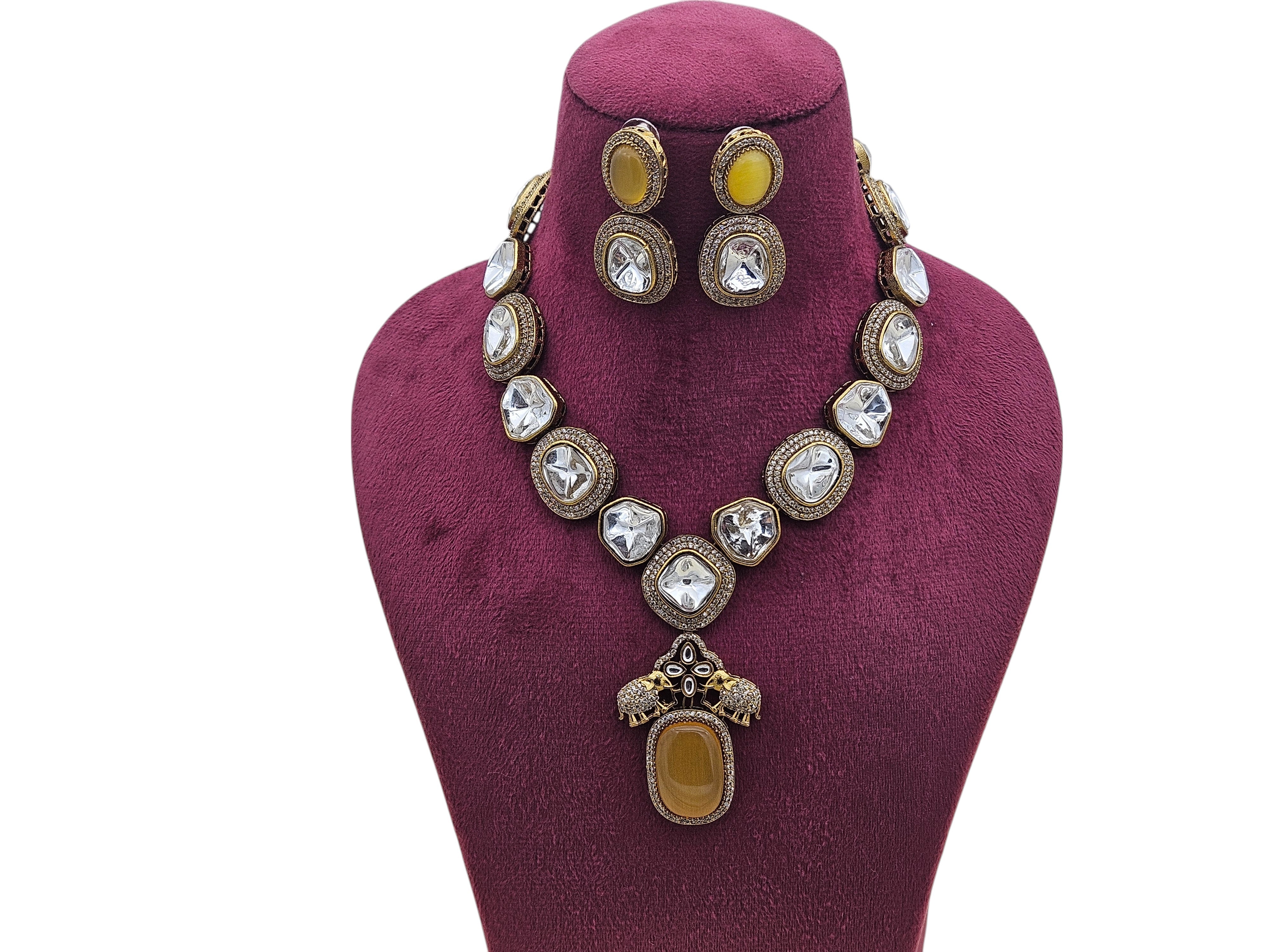 Macro shot capturing the fine craftsmanship of Polky and American diamonds on antique gold-plated jewelry
