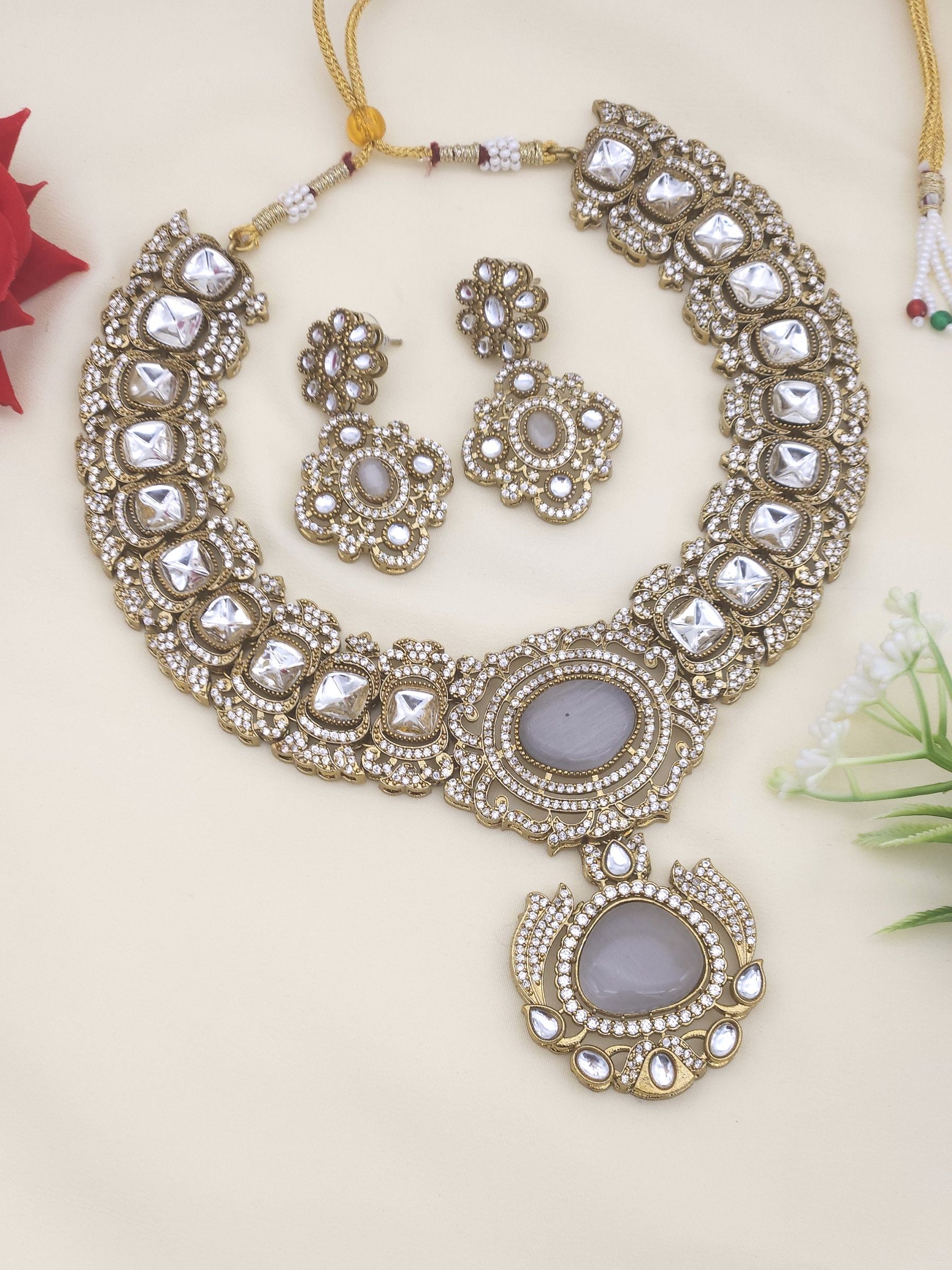 Handcrafted antique gold plated statement necklace and earrings with AD and Polky stones – bridal and party wear set
