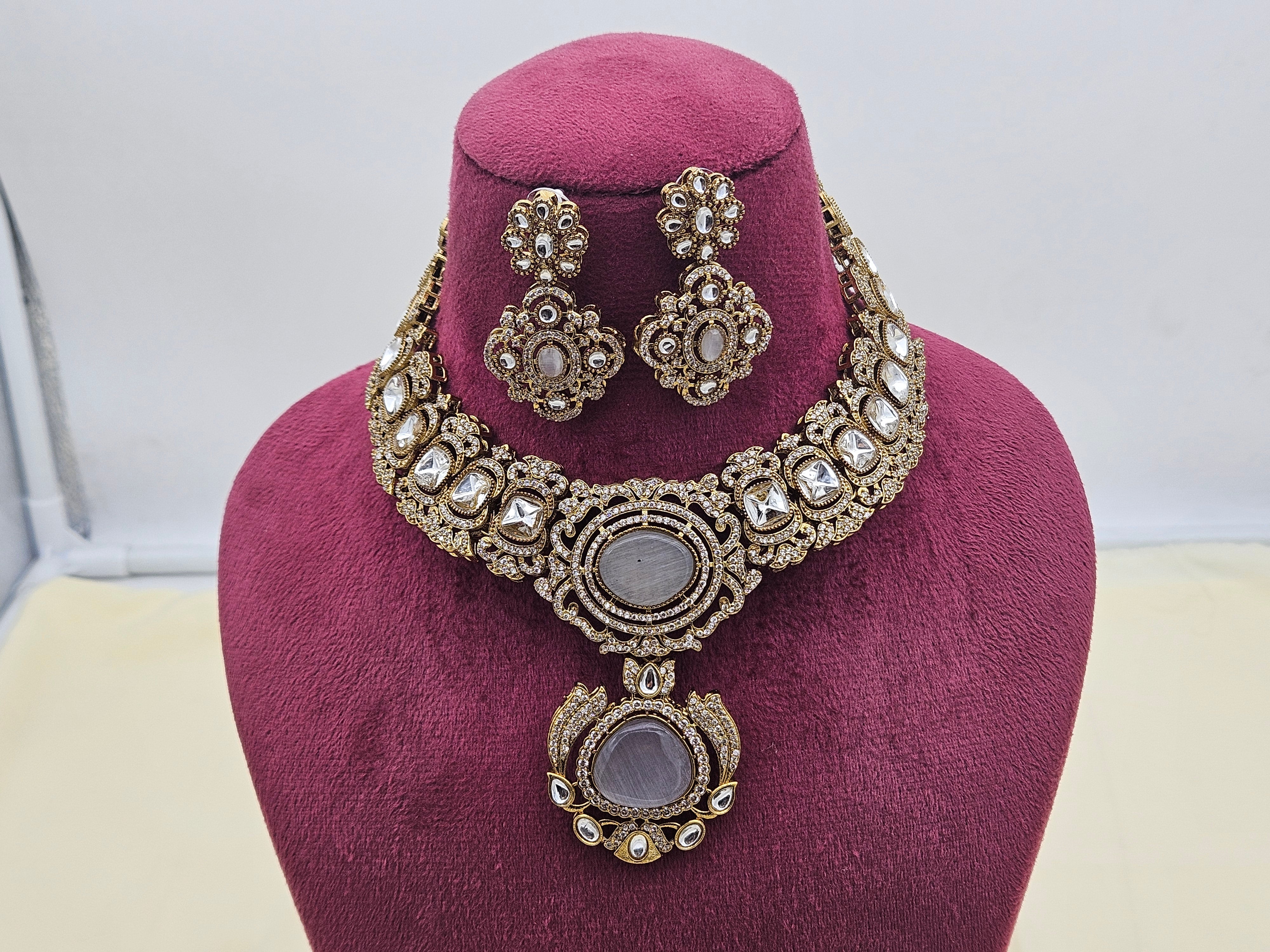 Vintage-inspired gold-plated necklace and earrings featuring dazzling AD and traditional Polky stones for party or bridal looks
