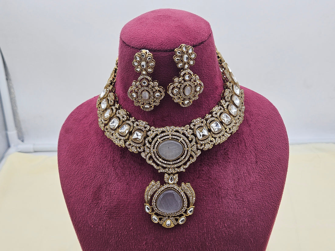 Vintage-inspired gold-plated necklace and earrings featuring dazzling AD and traditional Polky stones for party or bridal looks
