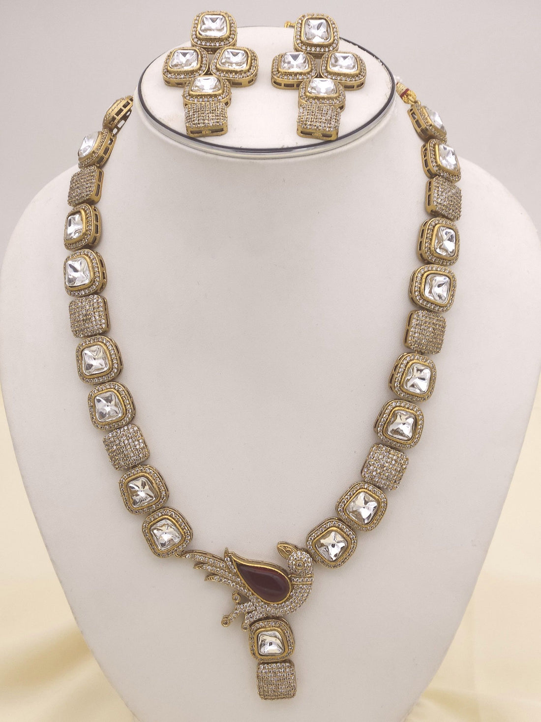 Handcrafted party and bridal jewelry set featuring a designer gold finish with Polky and American Diamond embellishments
