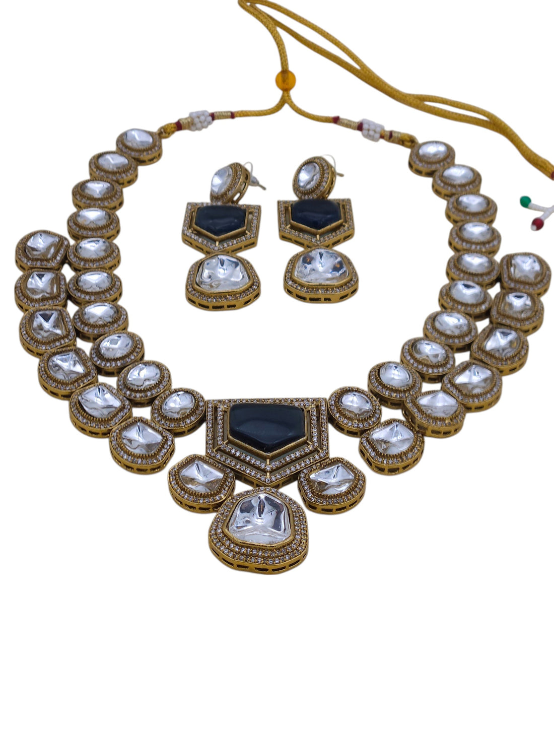 Antique gold finish necklace and earring set featuring Polky and sparkling AD stones, perfect for bridal and festive looks

